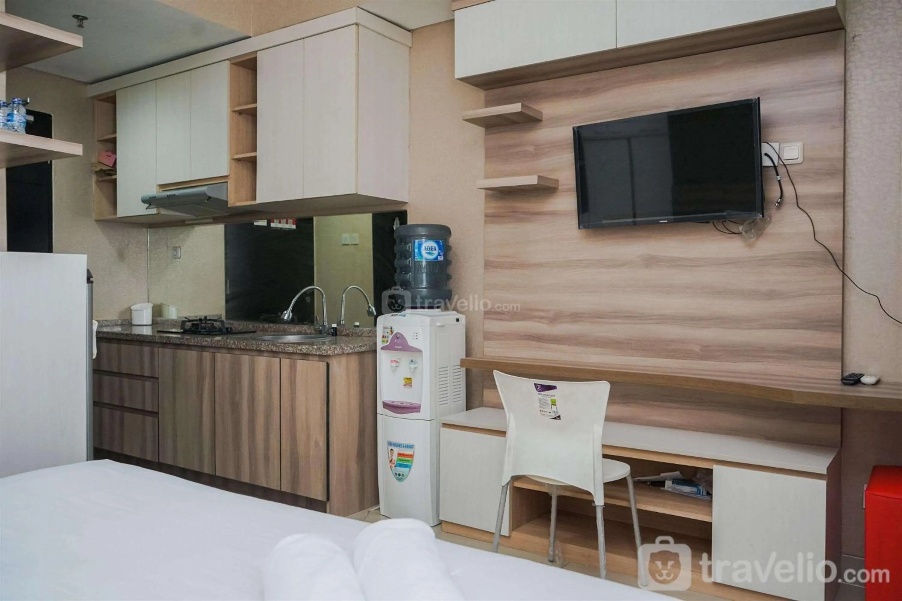 Bed in Cozy Stay Studio at Paramount Skyline Apartment By Travelio