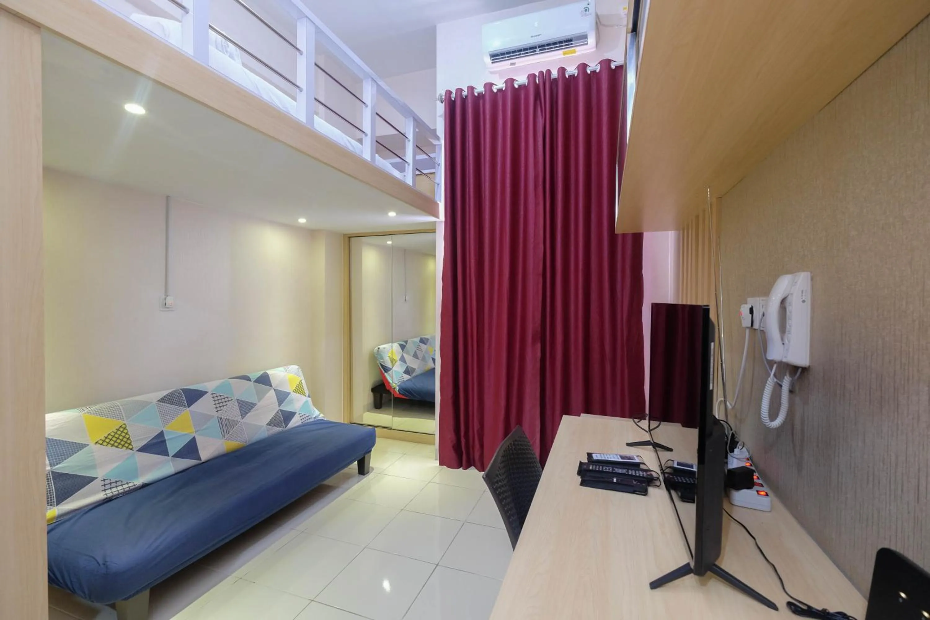 Bed in Comfy and Tidy Studio at Dave Apartment By Travelio