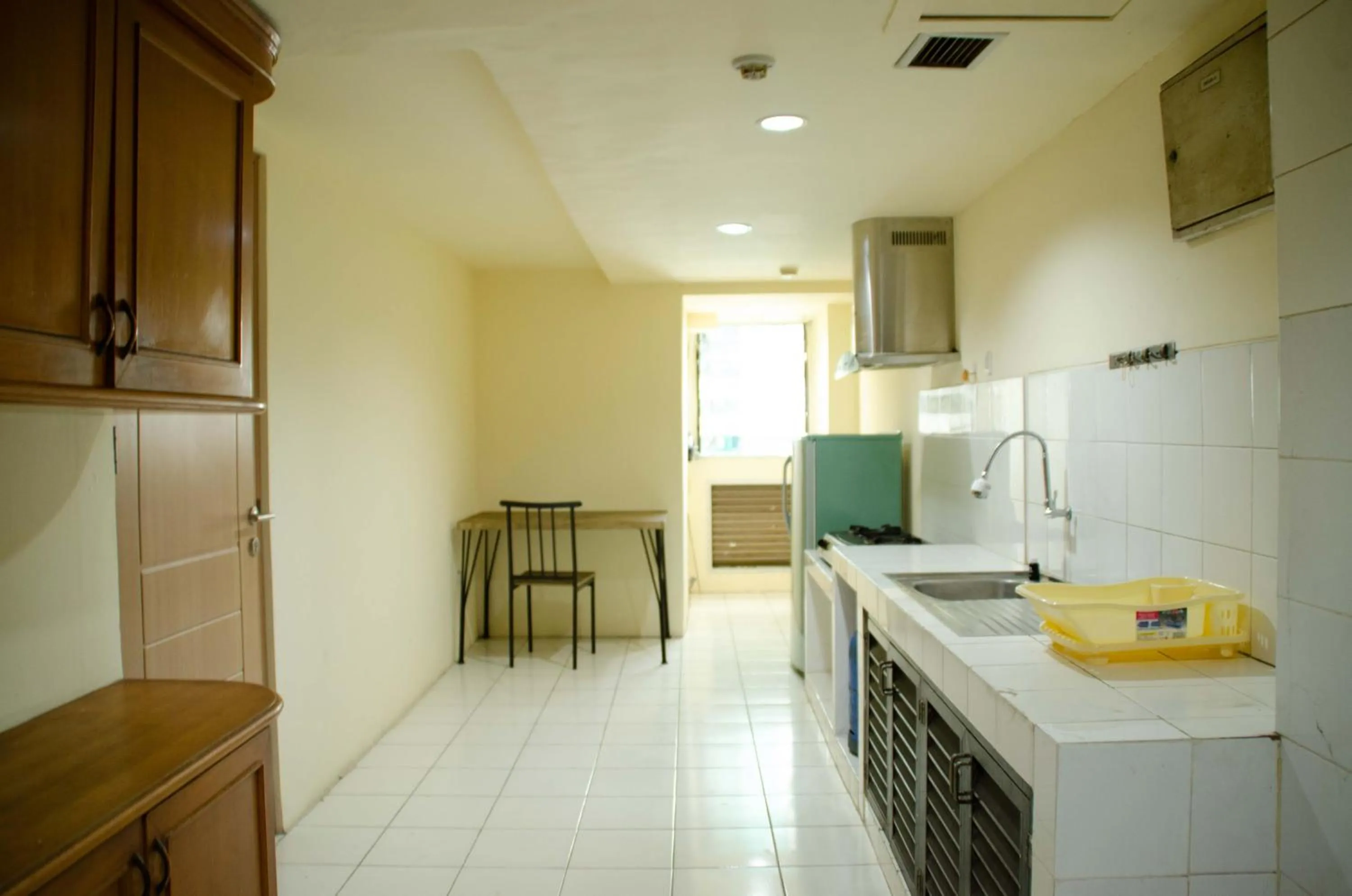 Kitchen or kitchenette in Spacious and Homey 3BR at Kondominium Rajawali Apartment By Travelio