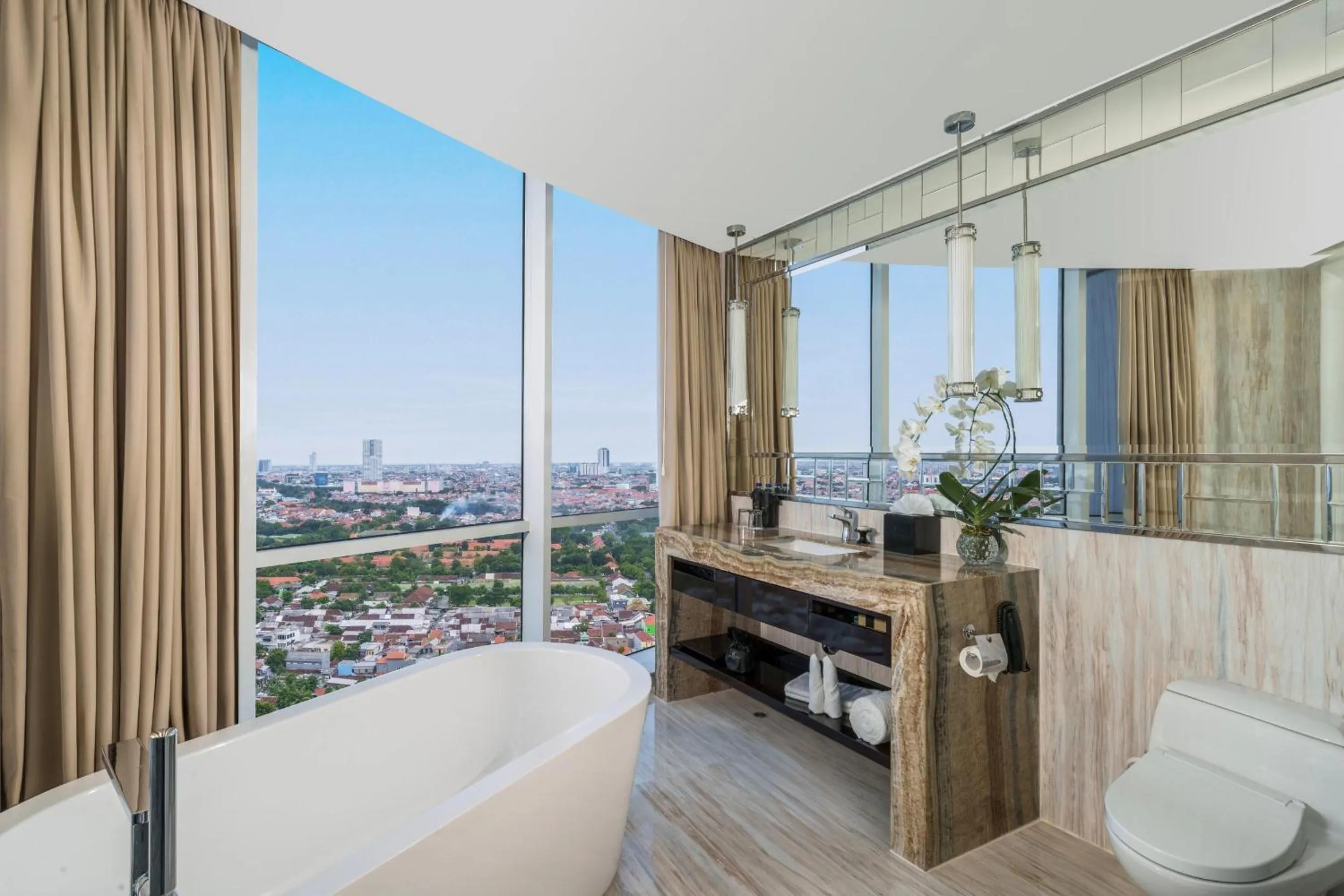 Bathroom in Hotel Ciputra World Surabaya managed by Swiss-Belhotel International