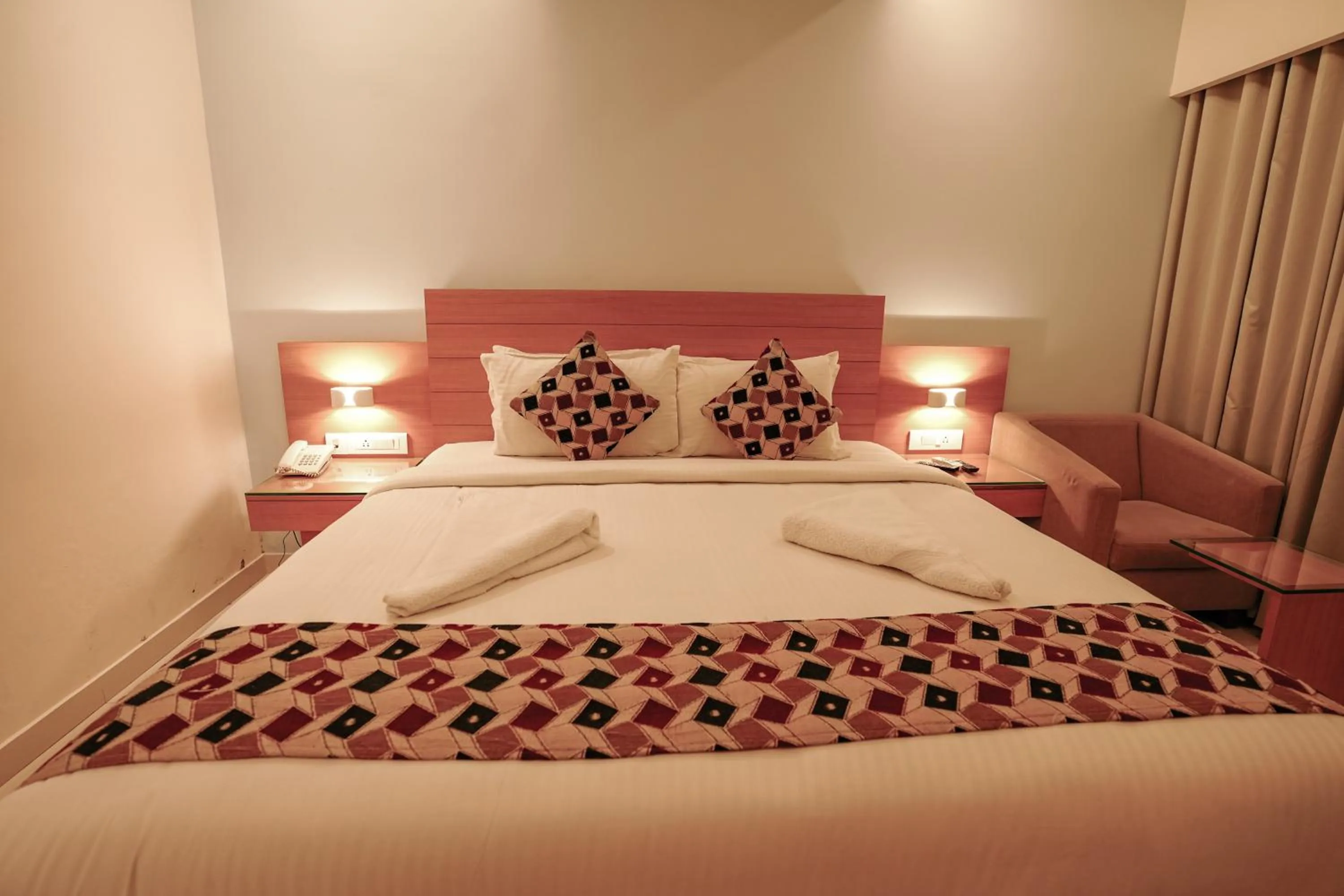 Bed in Hotel Indriya Wayanad