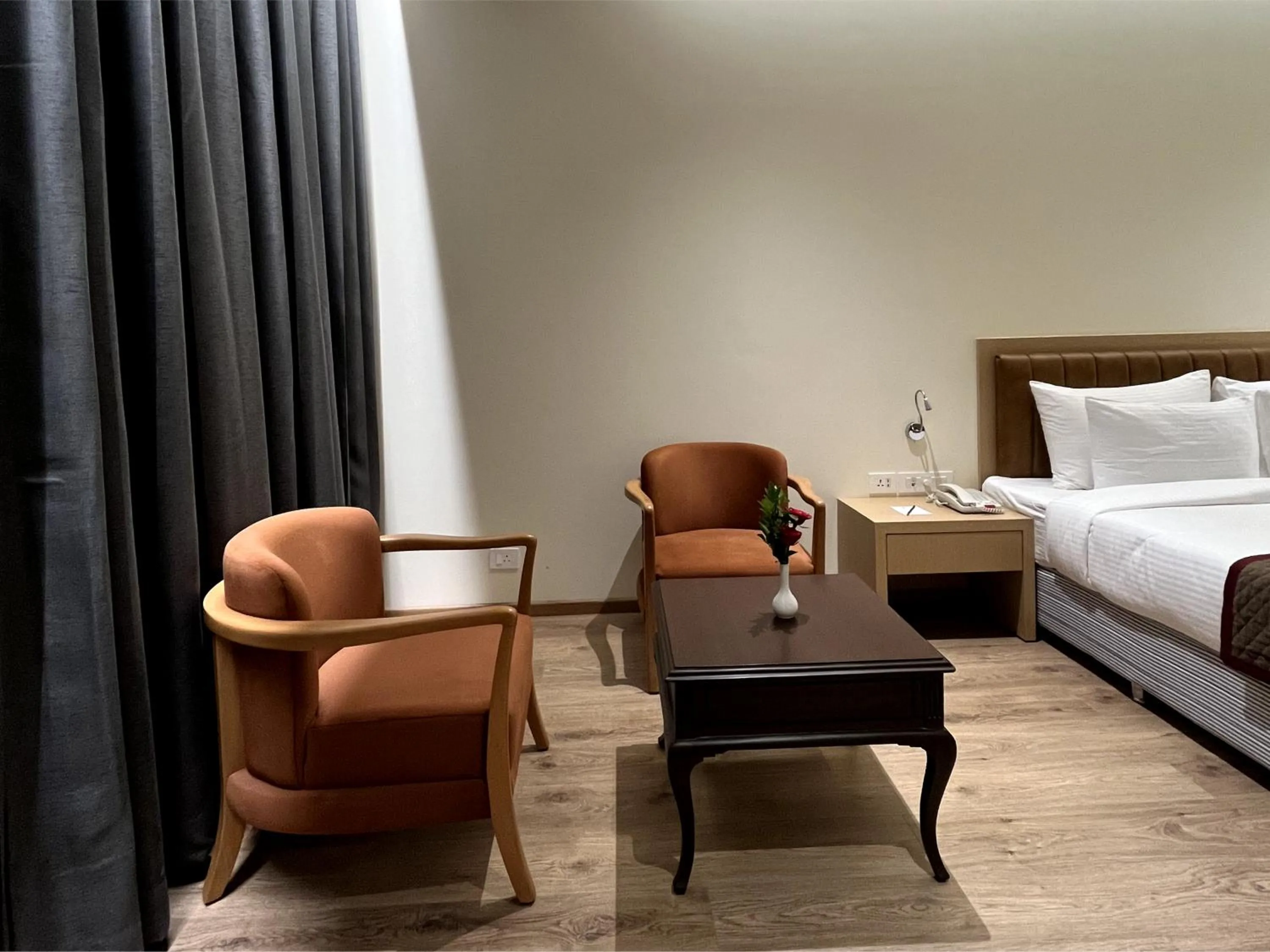 Seating area, Bed in Ramee Panchshil