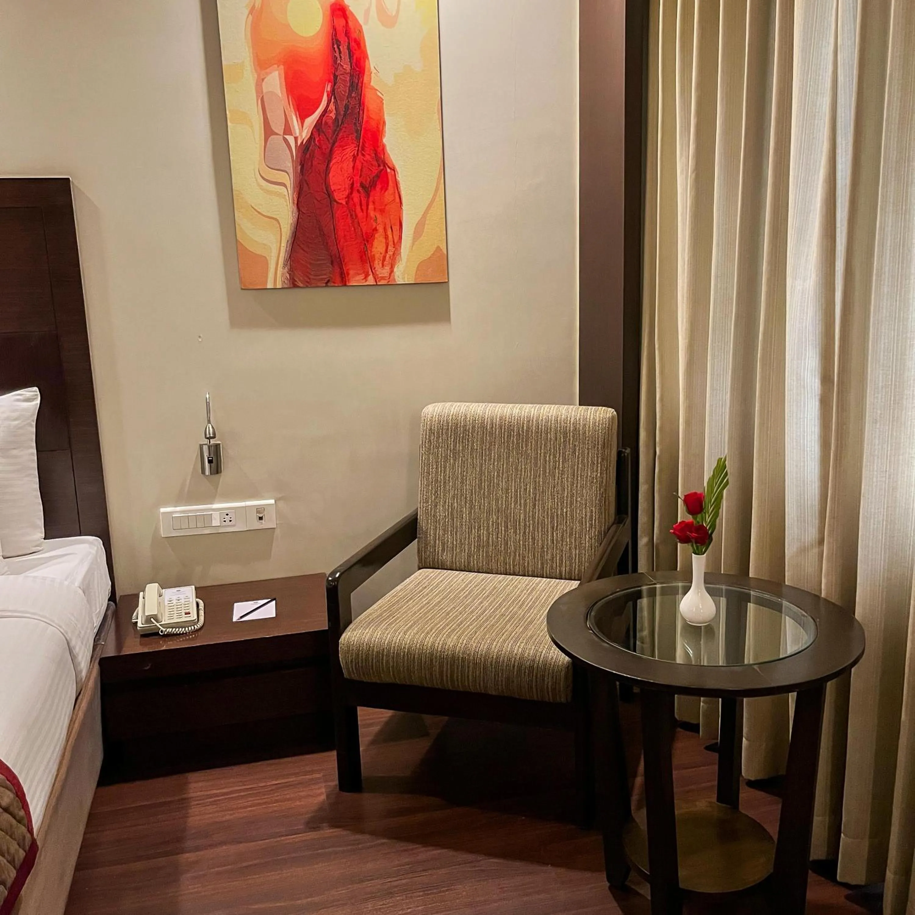 Seating area, Bed in Ramee Panchshil