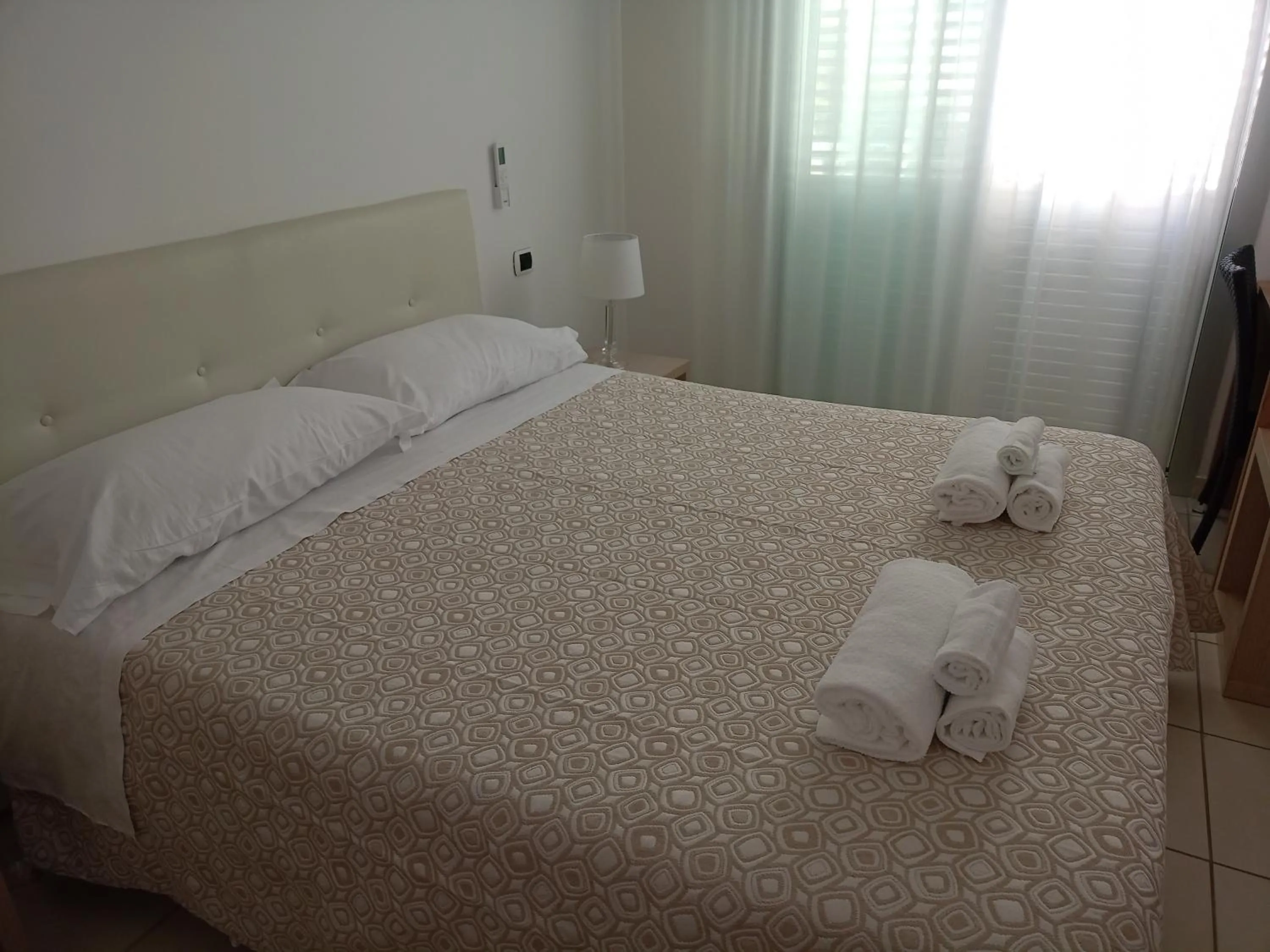 Bed in Hotel Riviera