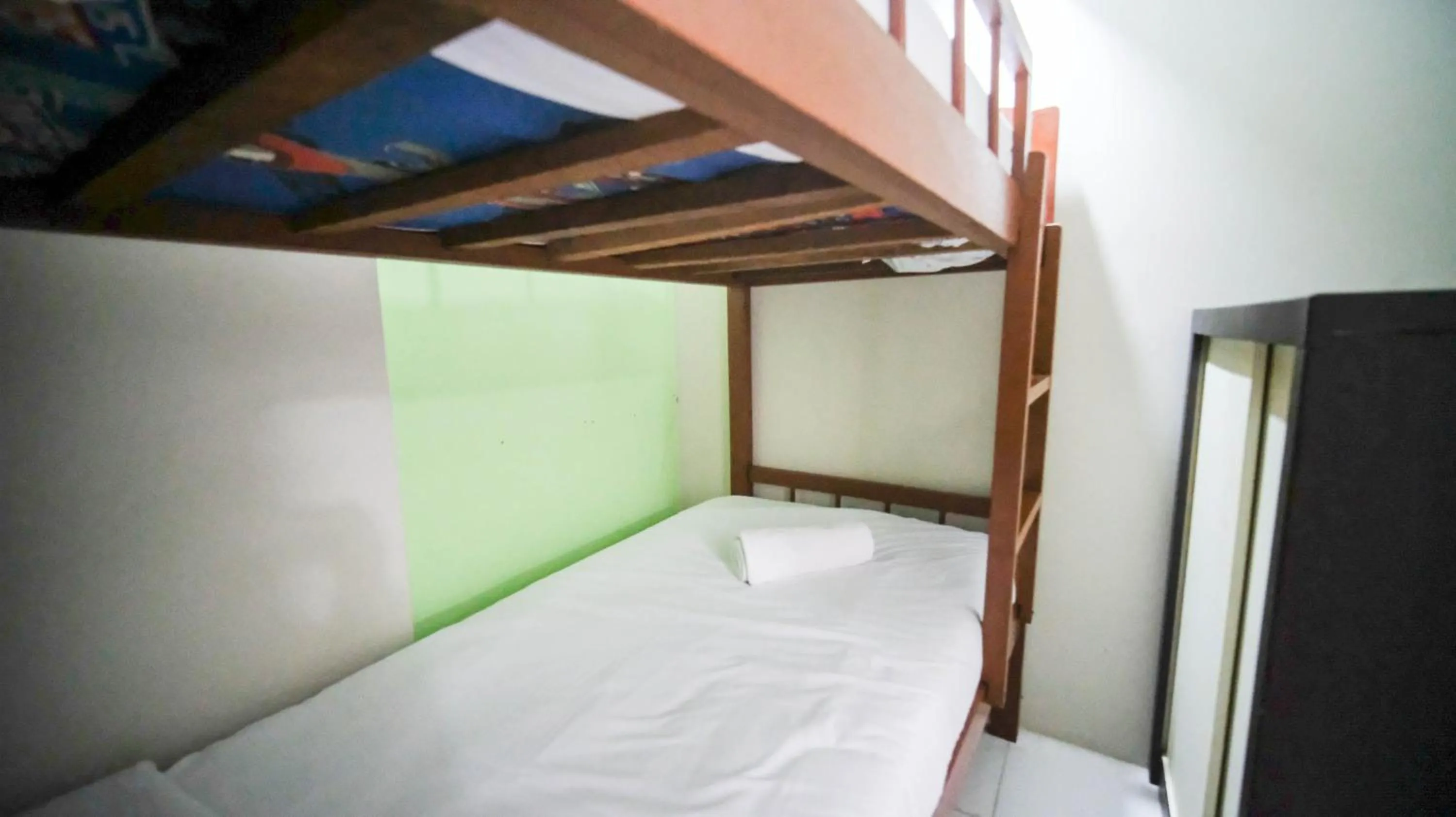 Bed in Homey and Comfy 2BR at Dian Regency Apartment By Travelio