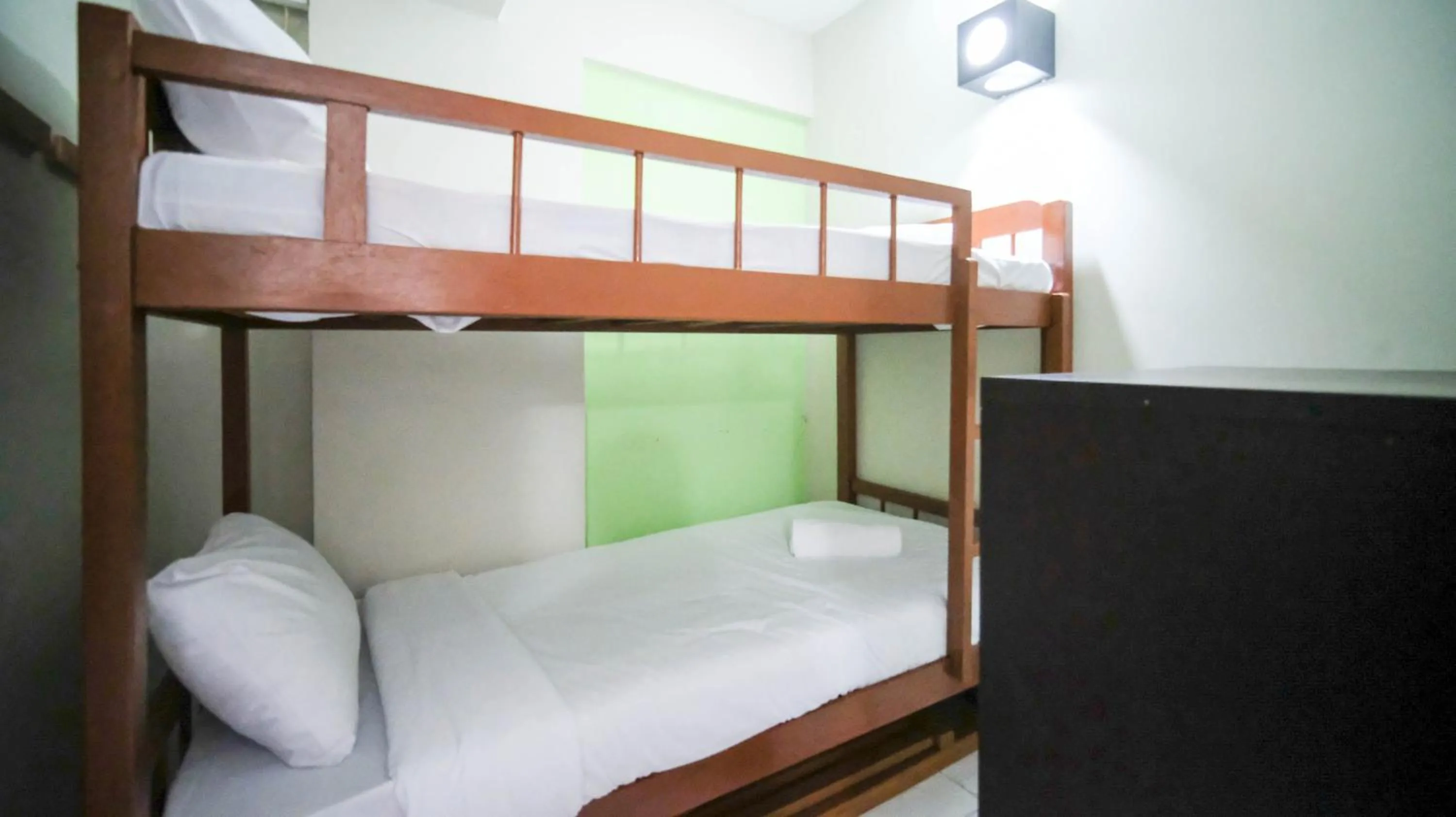 Bed in Homey and Comfy 2BR at Dian Regency Apartment By Travelio