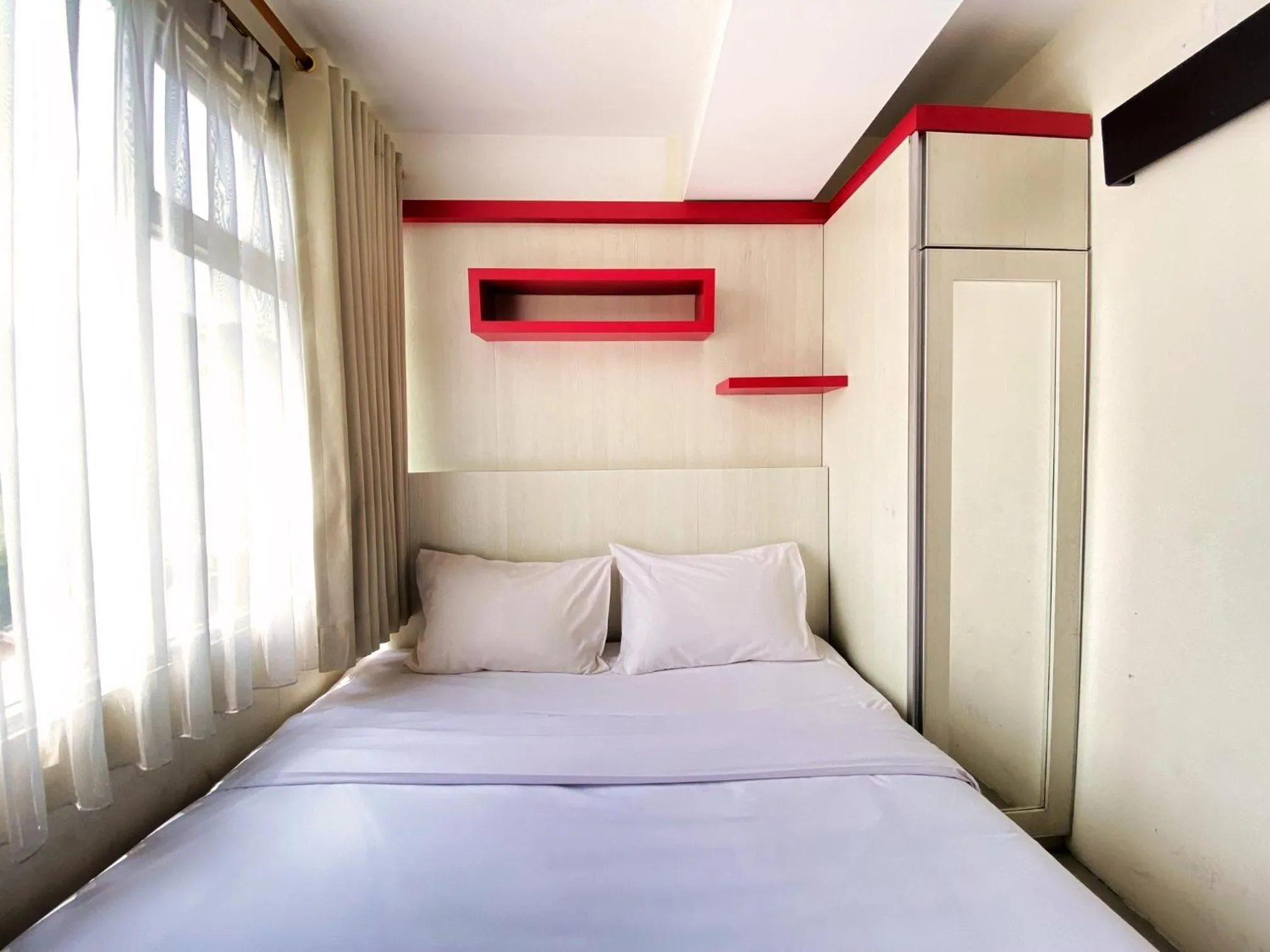 Bed in Spacious 2BR at Jarrdin Cihampelas Apartment By Travelio