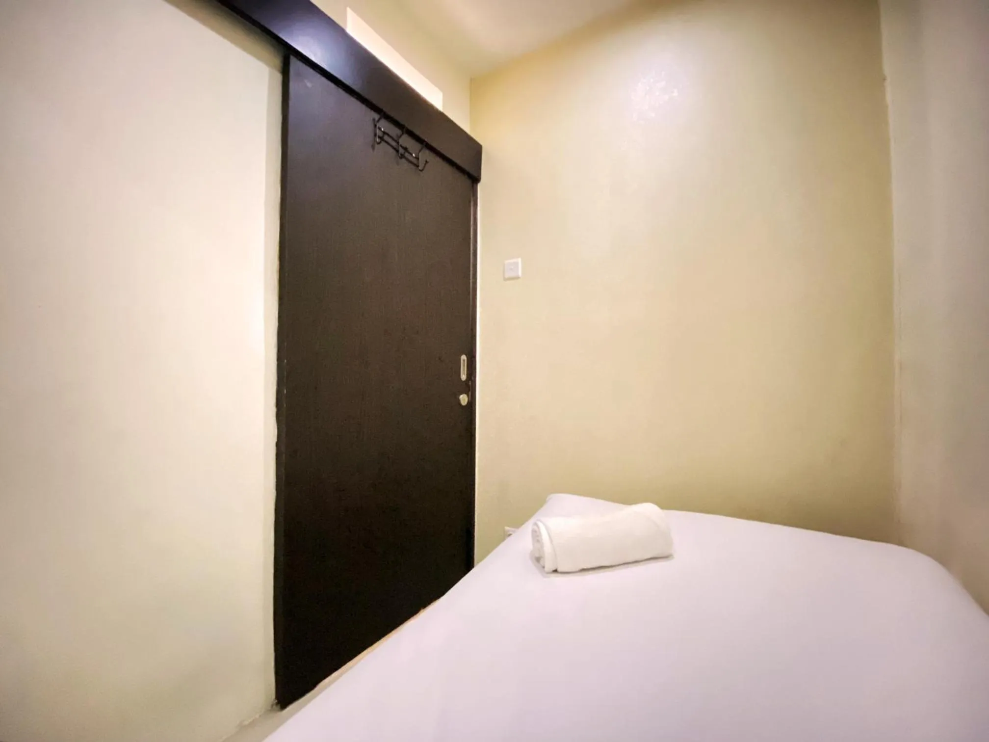 Bed in Spacious 2BR at Jarrdin Cihampelas Apartment By Travelio