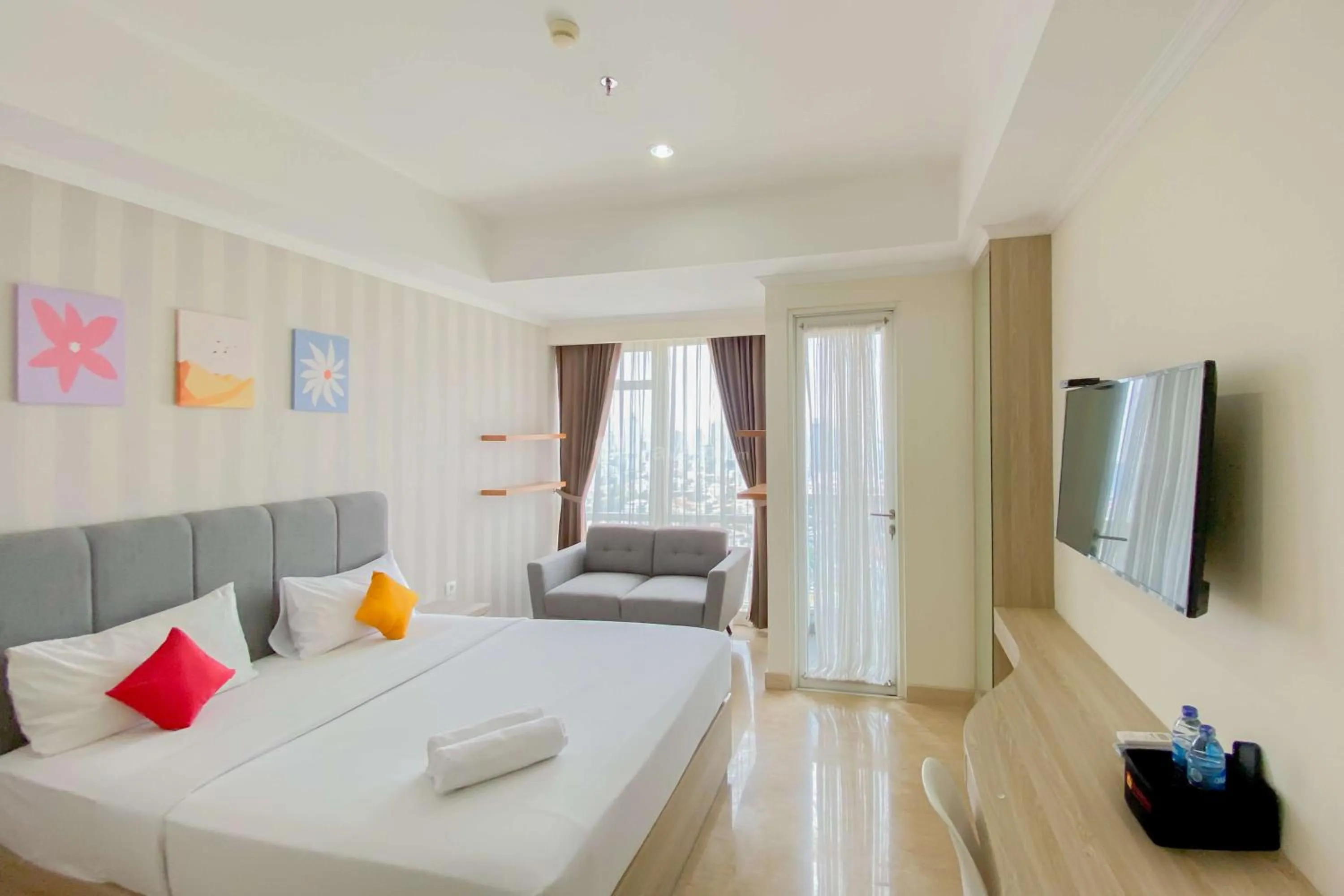 Bed in Good Choice and Elegant Studio Menteng Park Apartment By Travelio