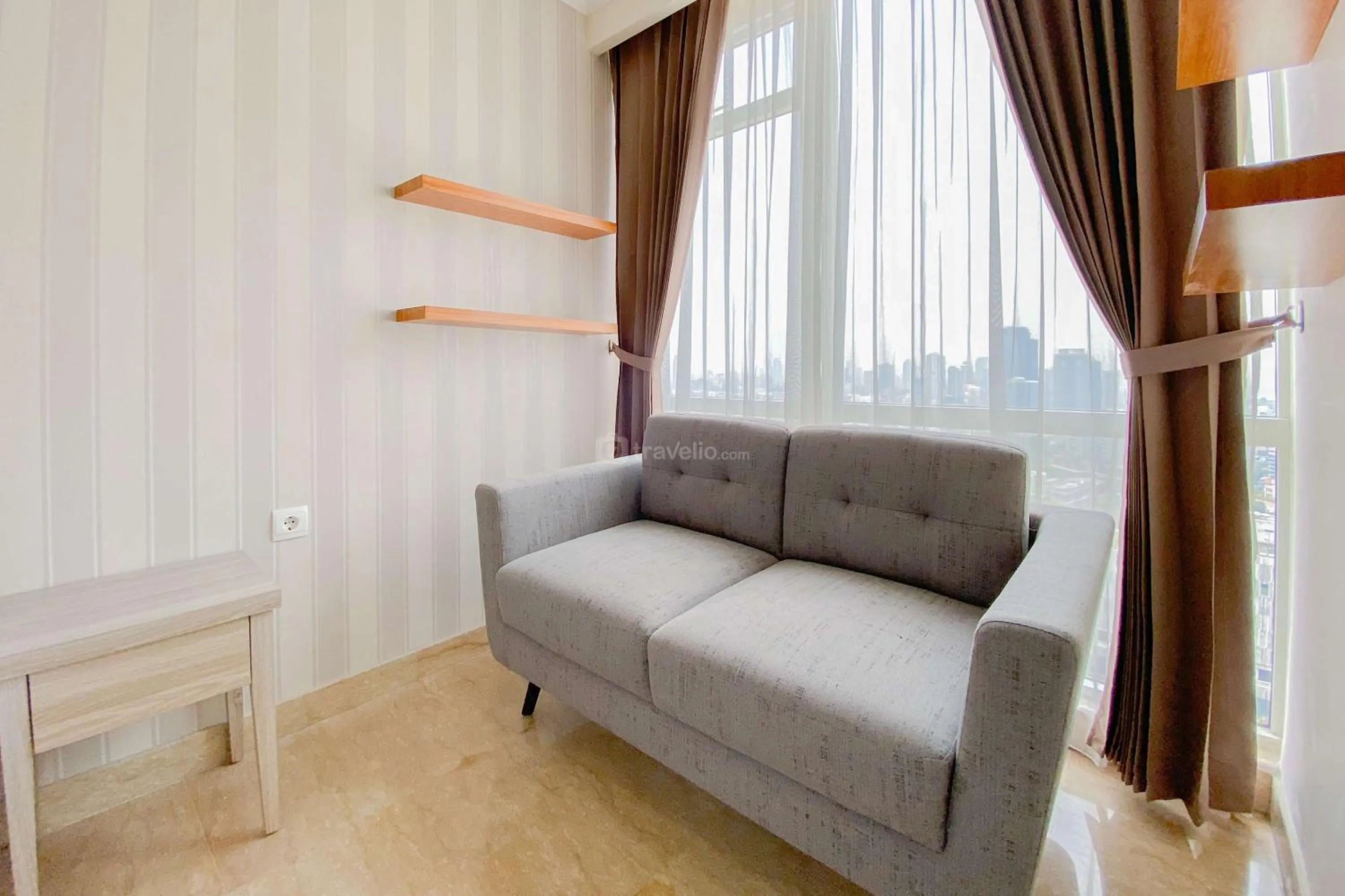 Bed in Good Choice and Elegant Studio Menteng Park Apartment By Travelio