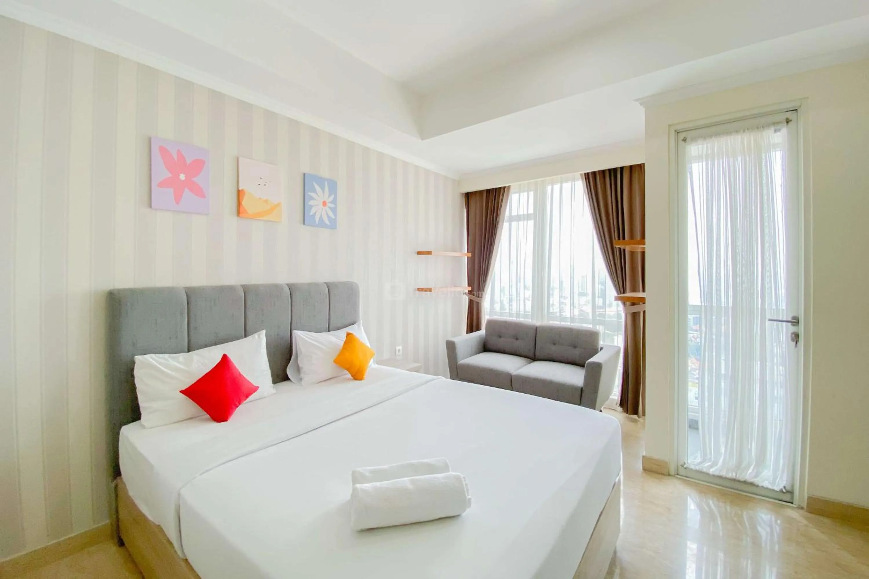 Bed in Good Choice and Elegant Studio Menteng Park Apartment By Travelio