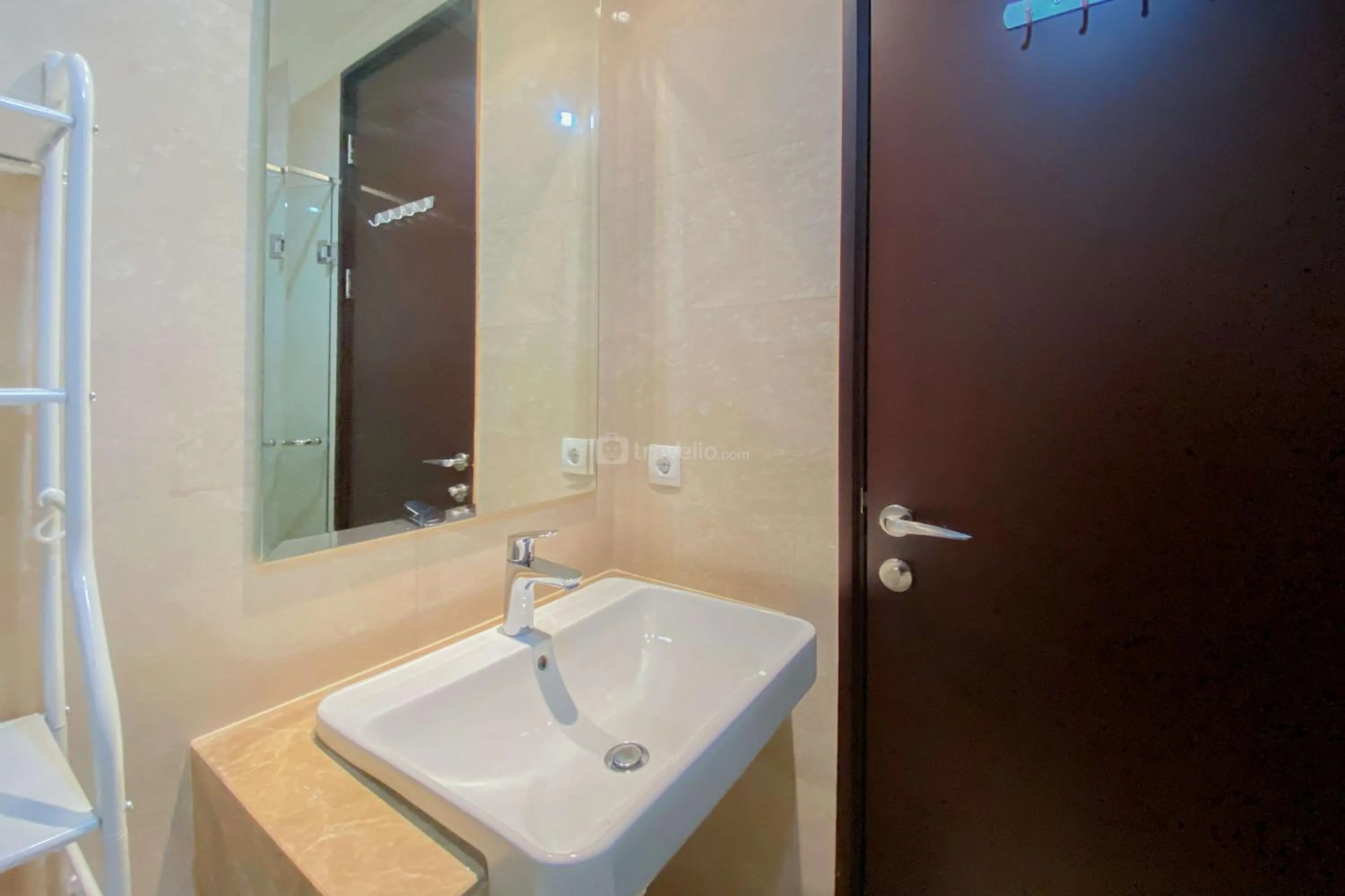 Bed in Good Choice and Elegant Studio Menteng Park Apartment By Travelio