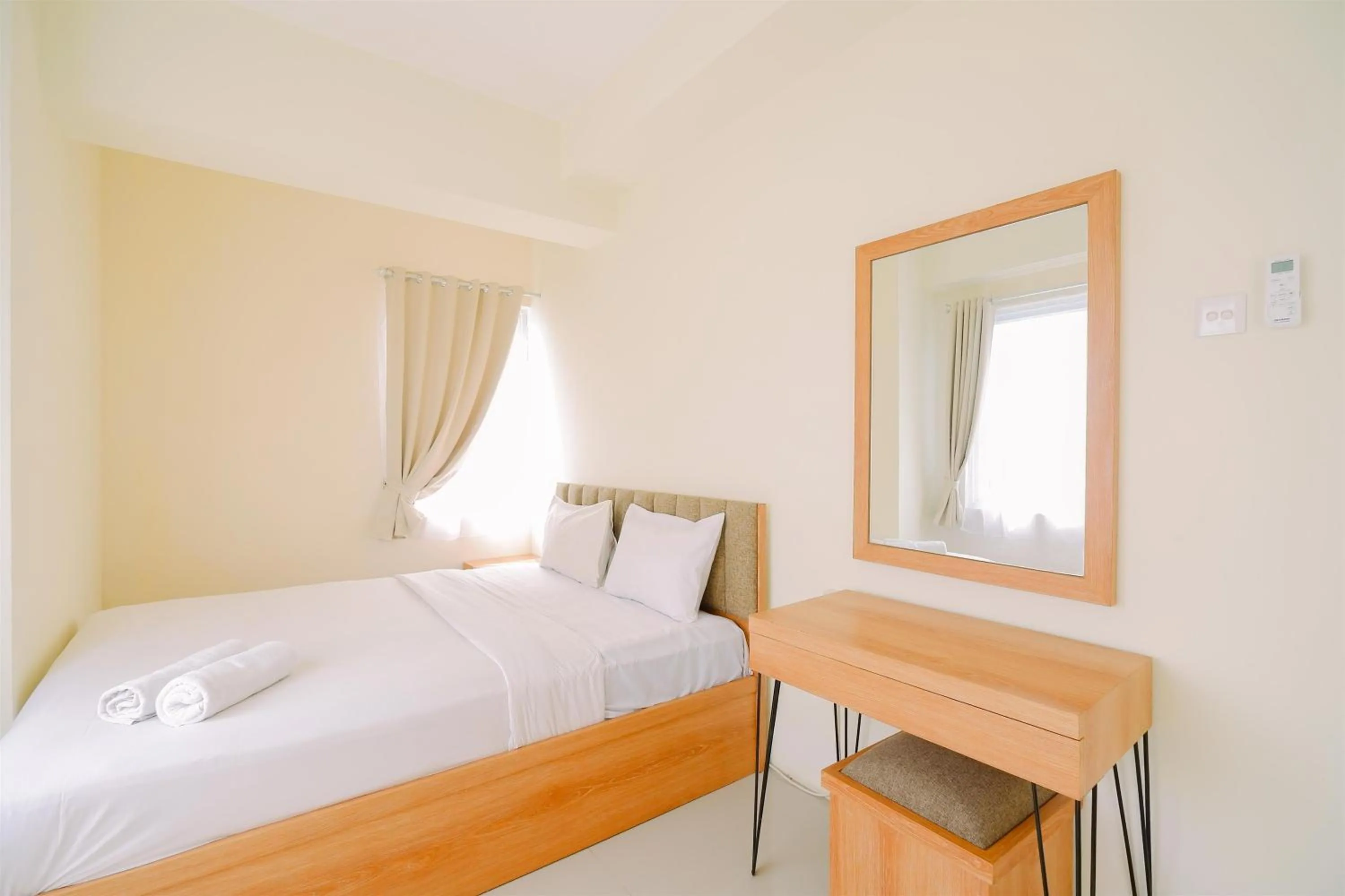 Bed in Warm and Cozy Living 2BR Bogorienze Apartment By Travelio