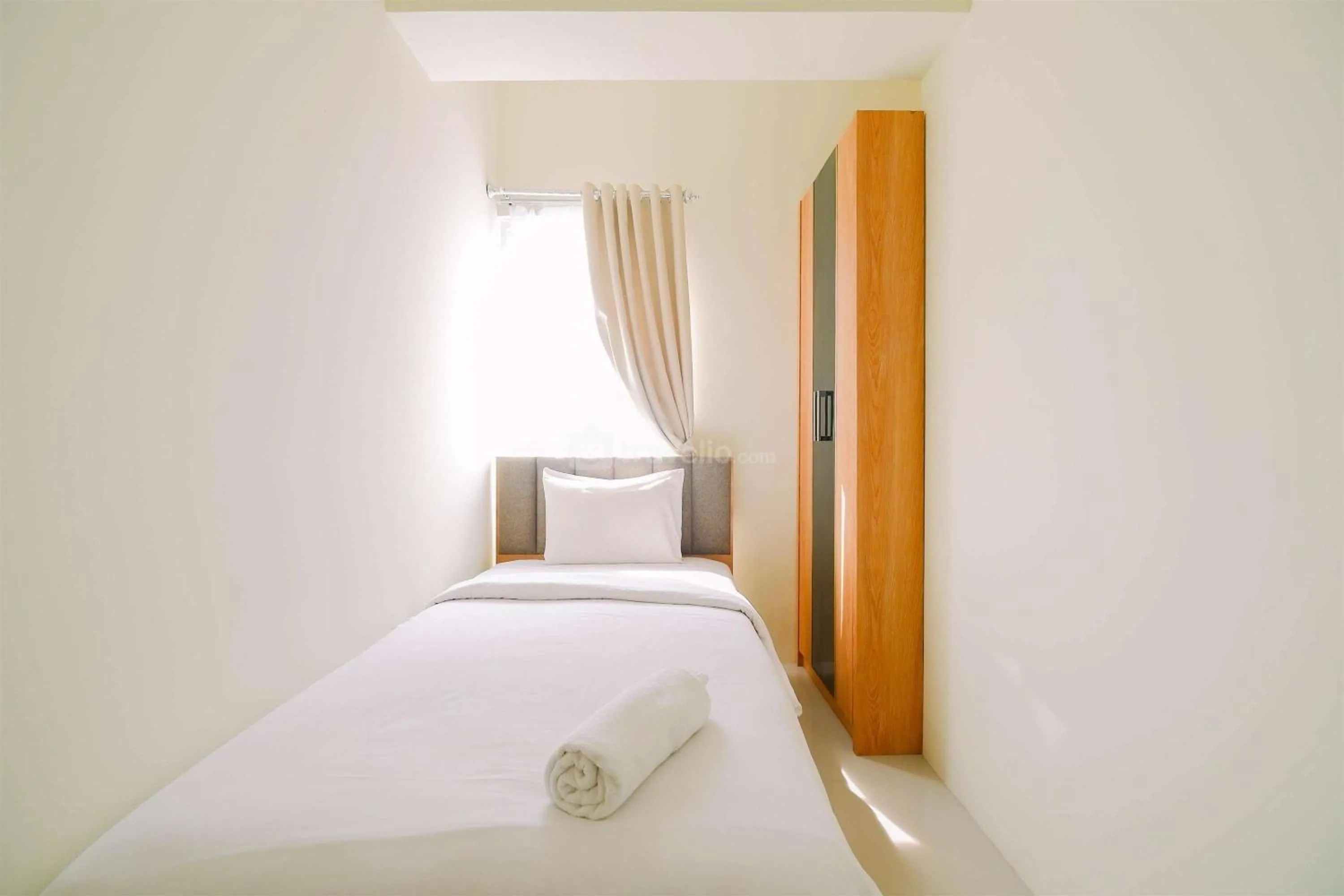 Bed in Warm and Cozy Living 2BR Bogorienze Apartment By Travelio