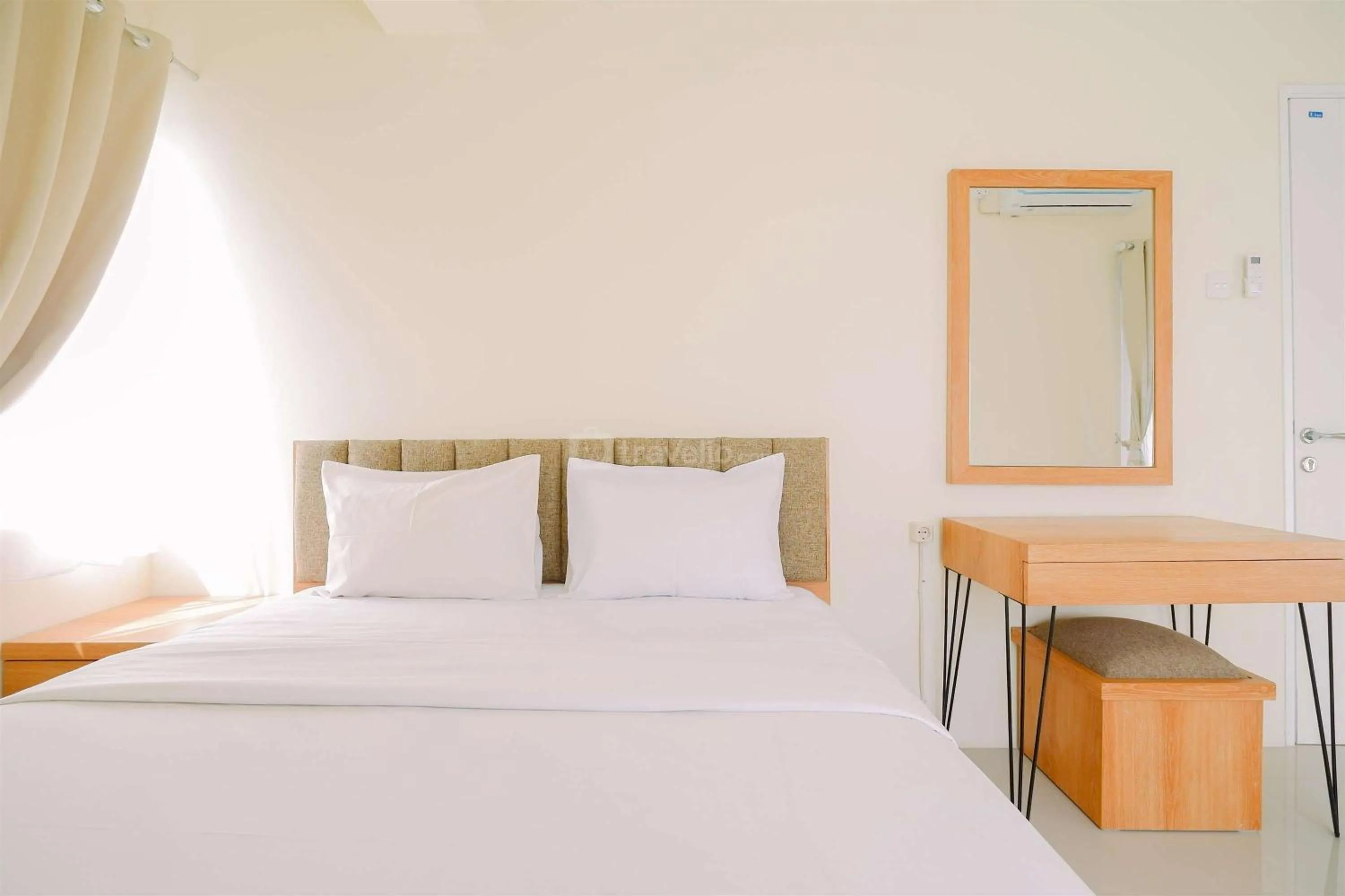 Bed in Warm and Cozy Living 2BR Bogorienze Apartment By Travelio