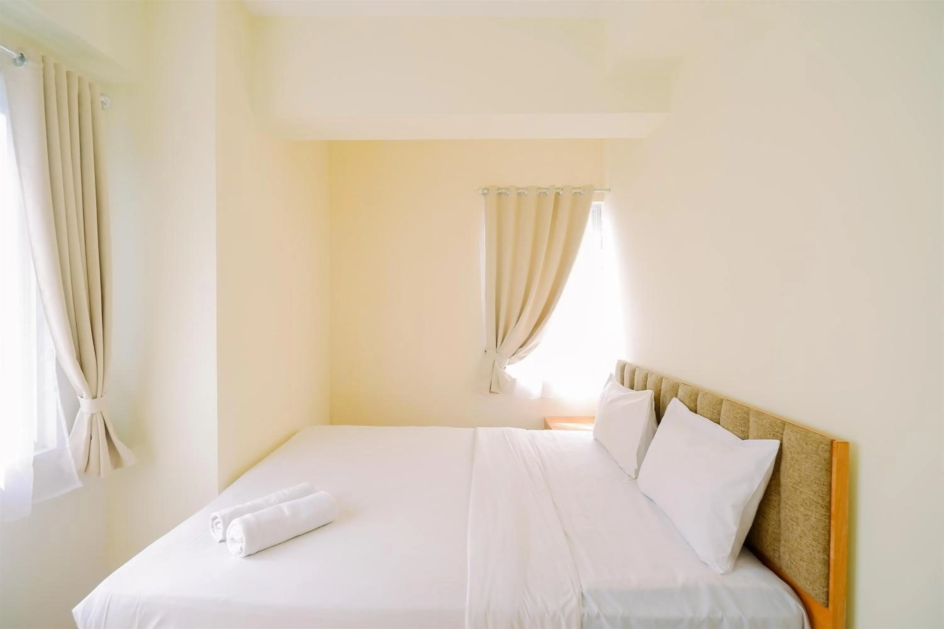 Bed in Warm and Cozy Living 2BR Bogorienze Apartment By Travelio