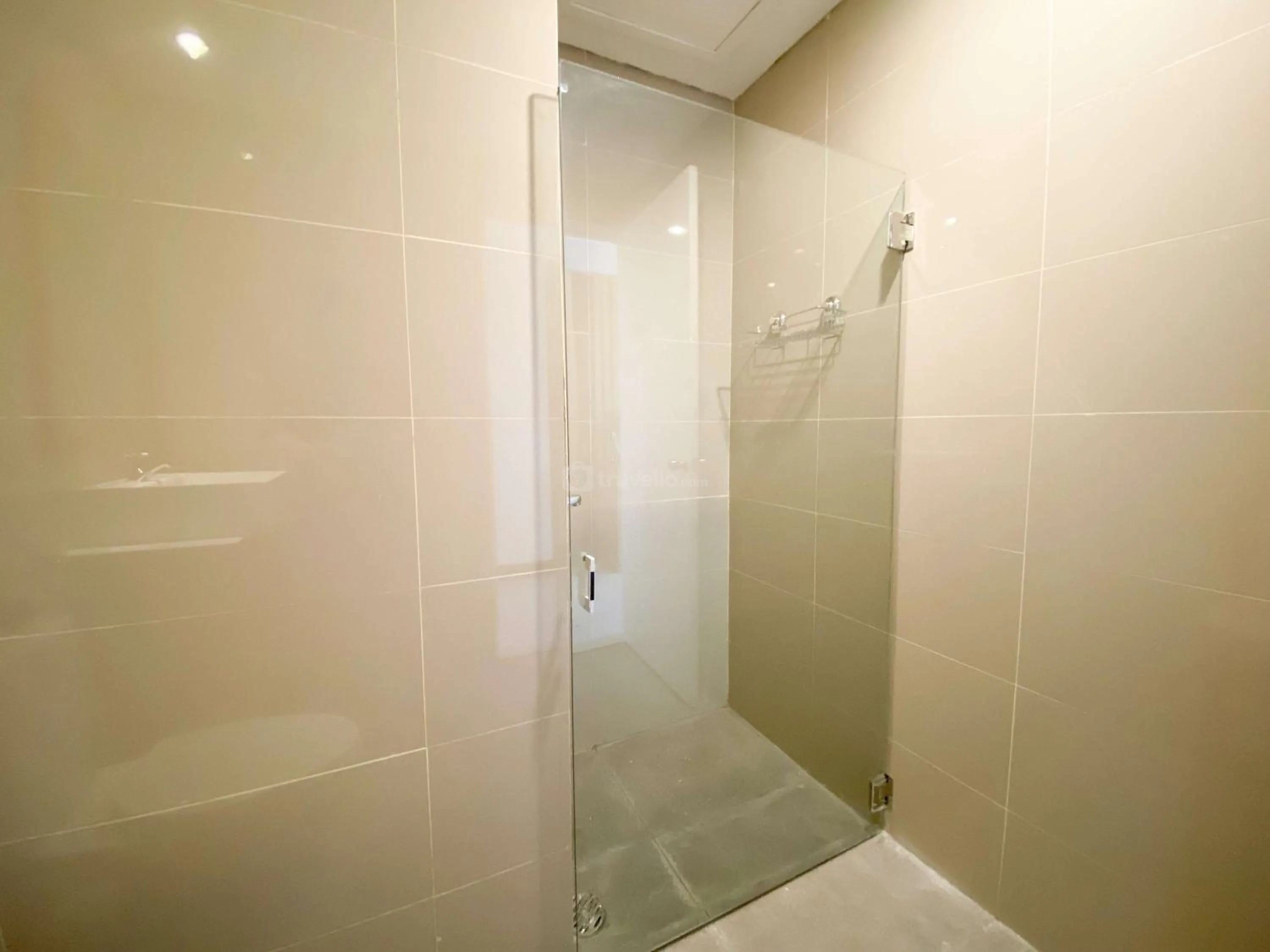 Bed in Homey and Strategic Studio (No Kitchen) at Sentraland Semarang Apartment By Travelio