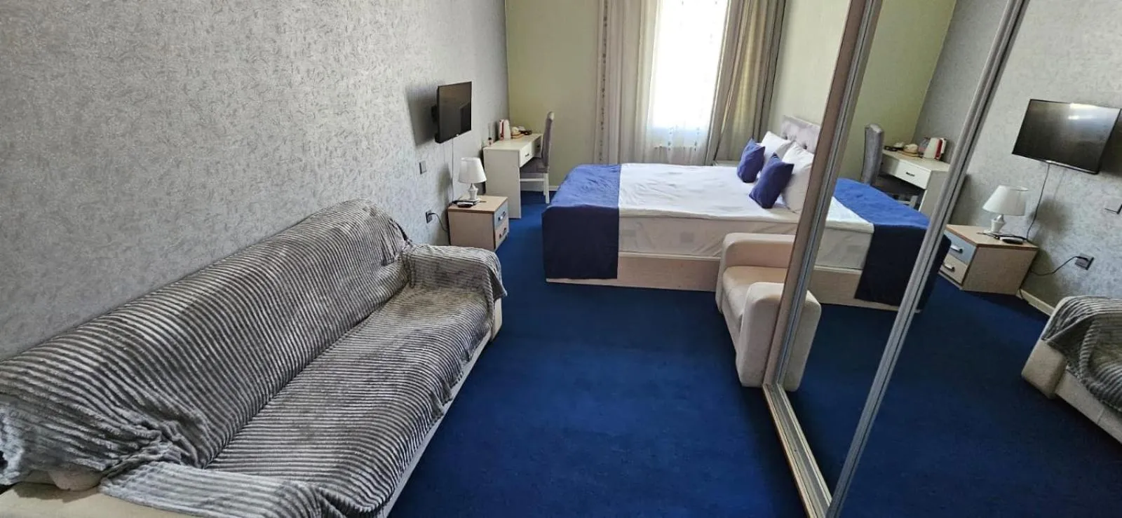 Bed in NH Nizami Hotel