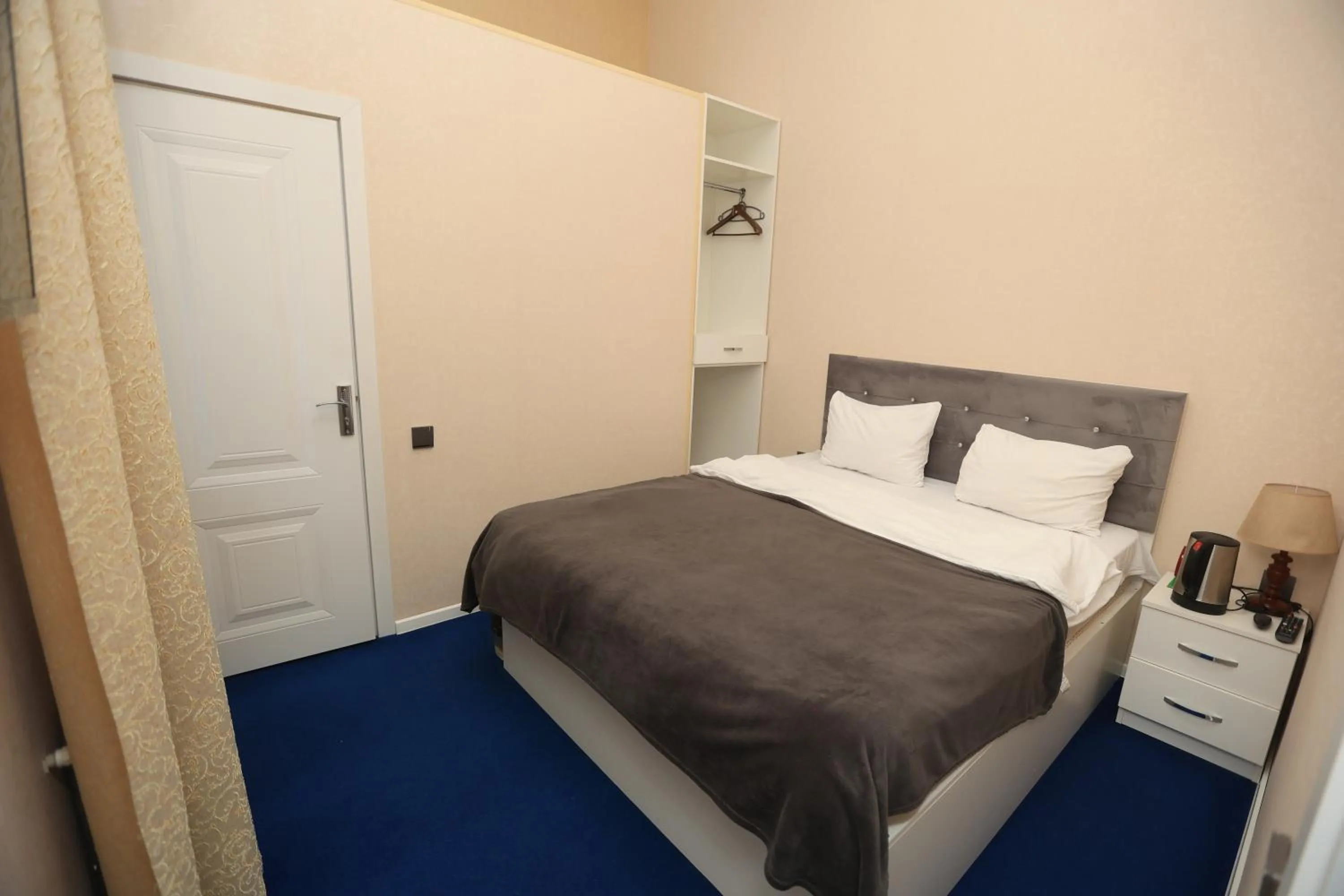 Bed in NH Nizami Hotel