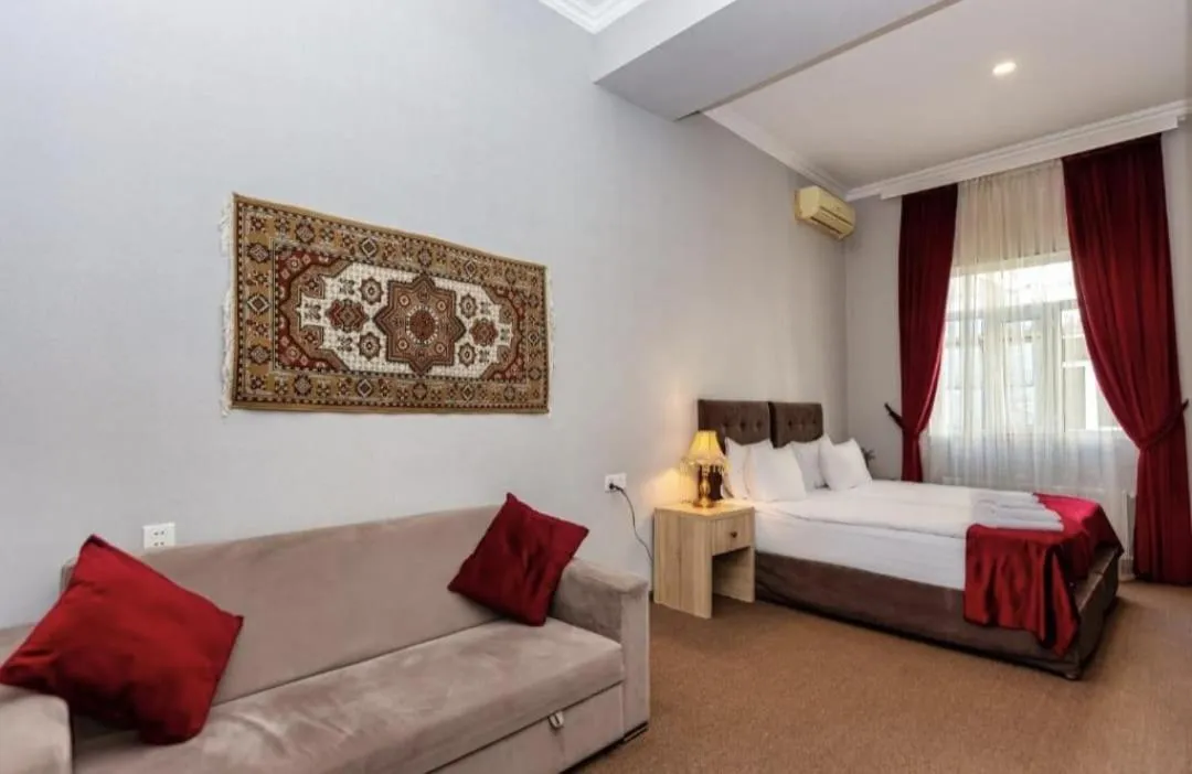 Bed in NH Nizami Hotel