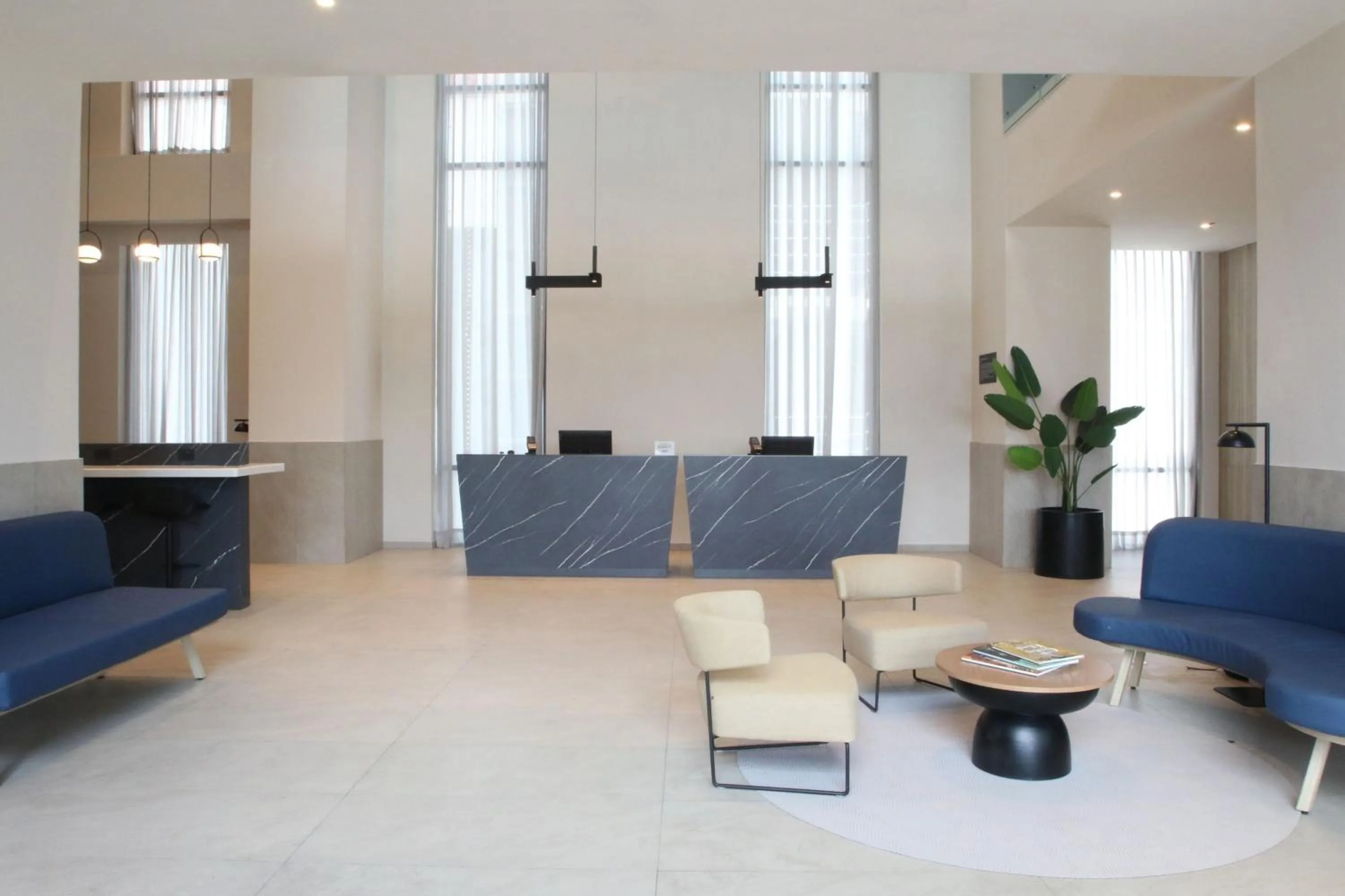 Lobby or reception in City Express Plus by Marriott Monterrey Centro