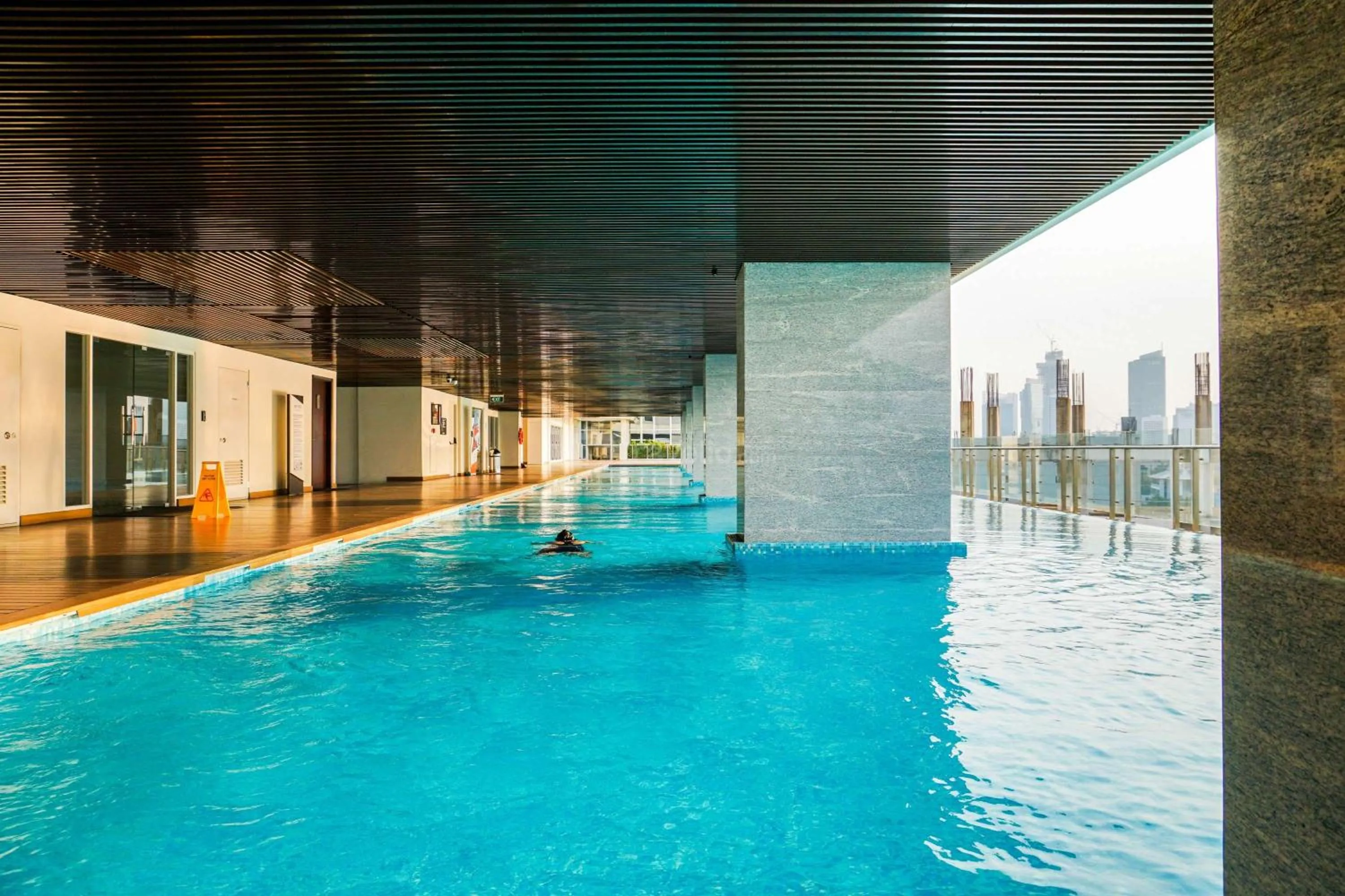 Swimming pool in Comfort and Modern Look Studio Menteng Park Apartment By Travelio