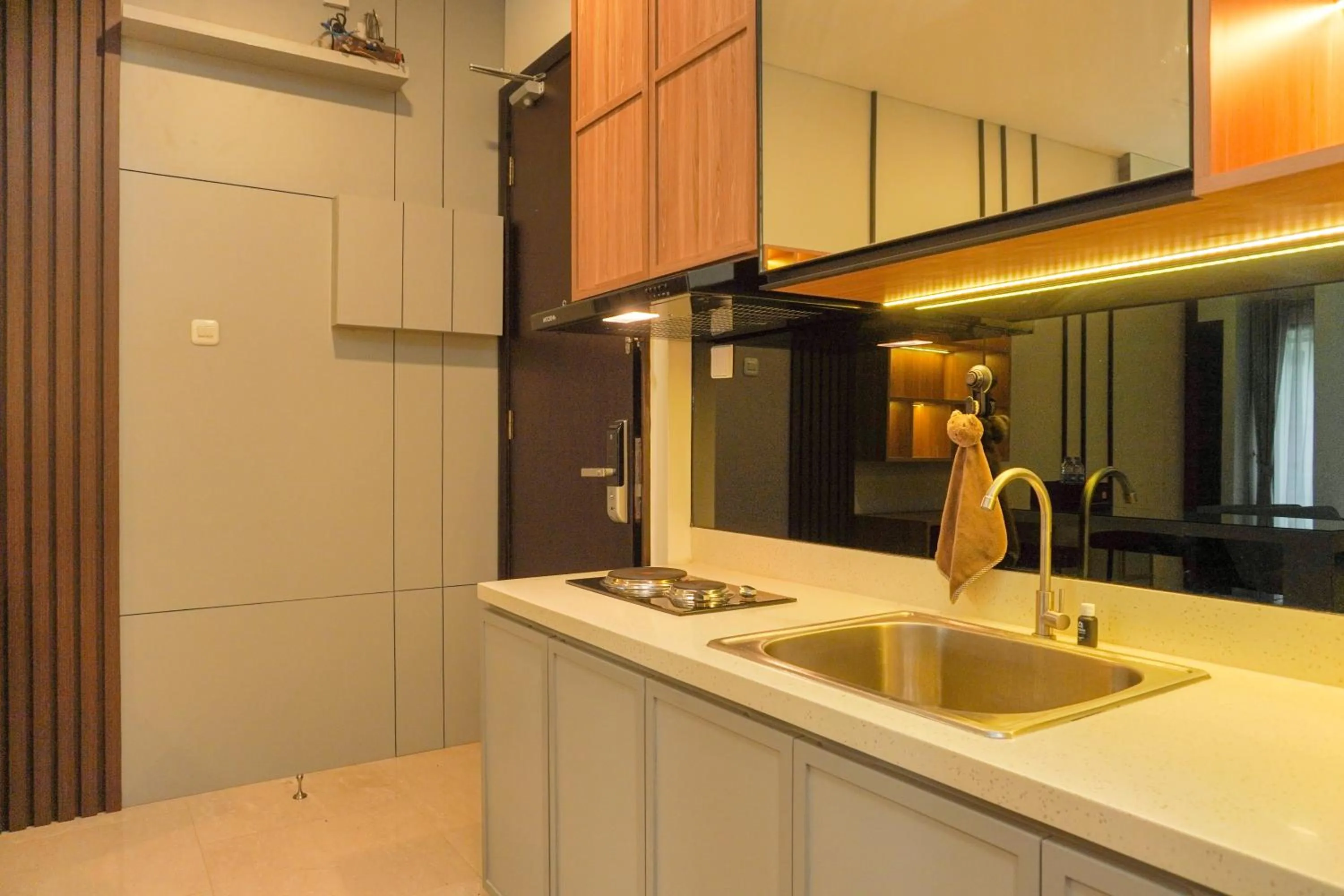 Kitchen or kitchenette in Comfort and Elegant 2BR Sudirman Suites Apartment By Travelio
