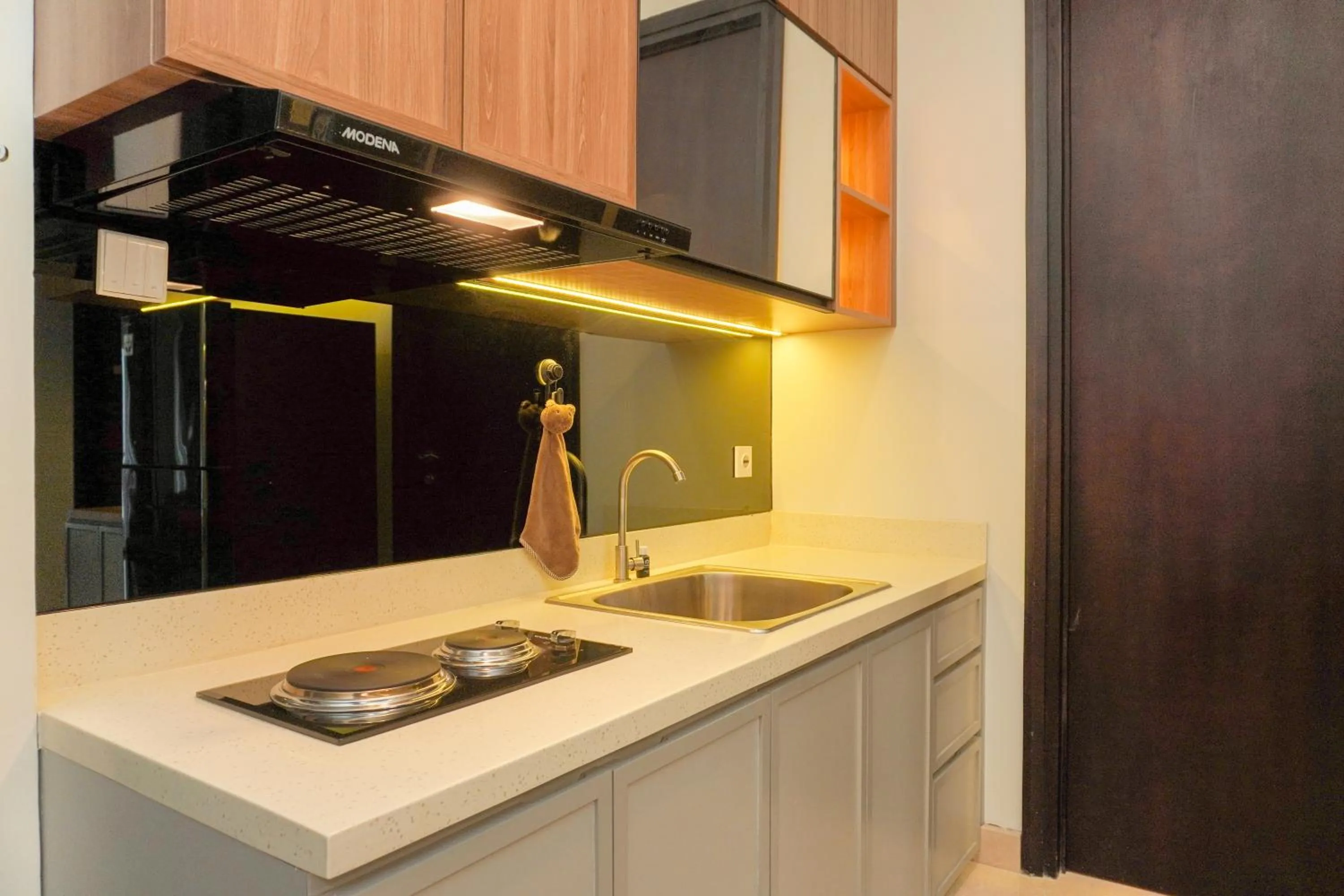 Kitchen or kitchenette in Comfort and Elegant 2BR Sudirman Suites Apartment By Travelio