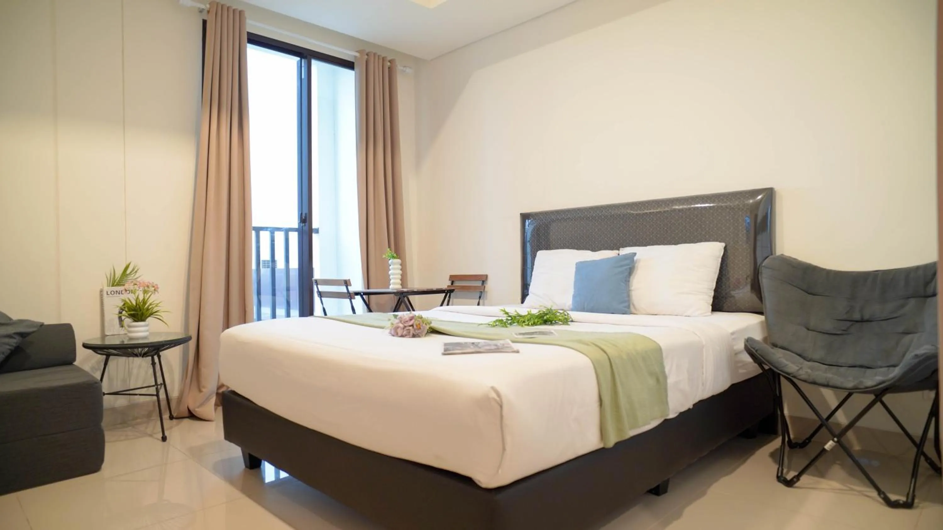 Bed in Spacious and Homey Studio at Cleon Park Apartment By Travelio