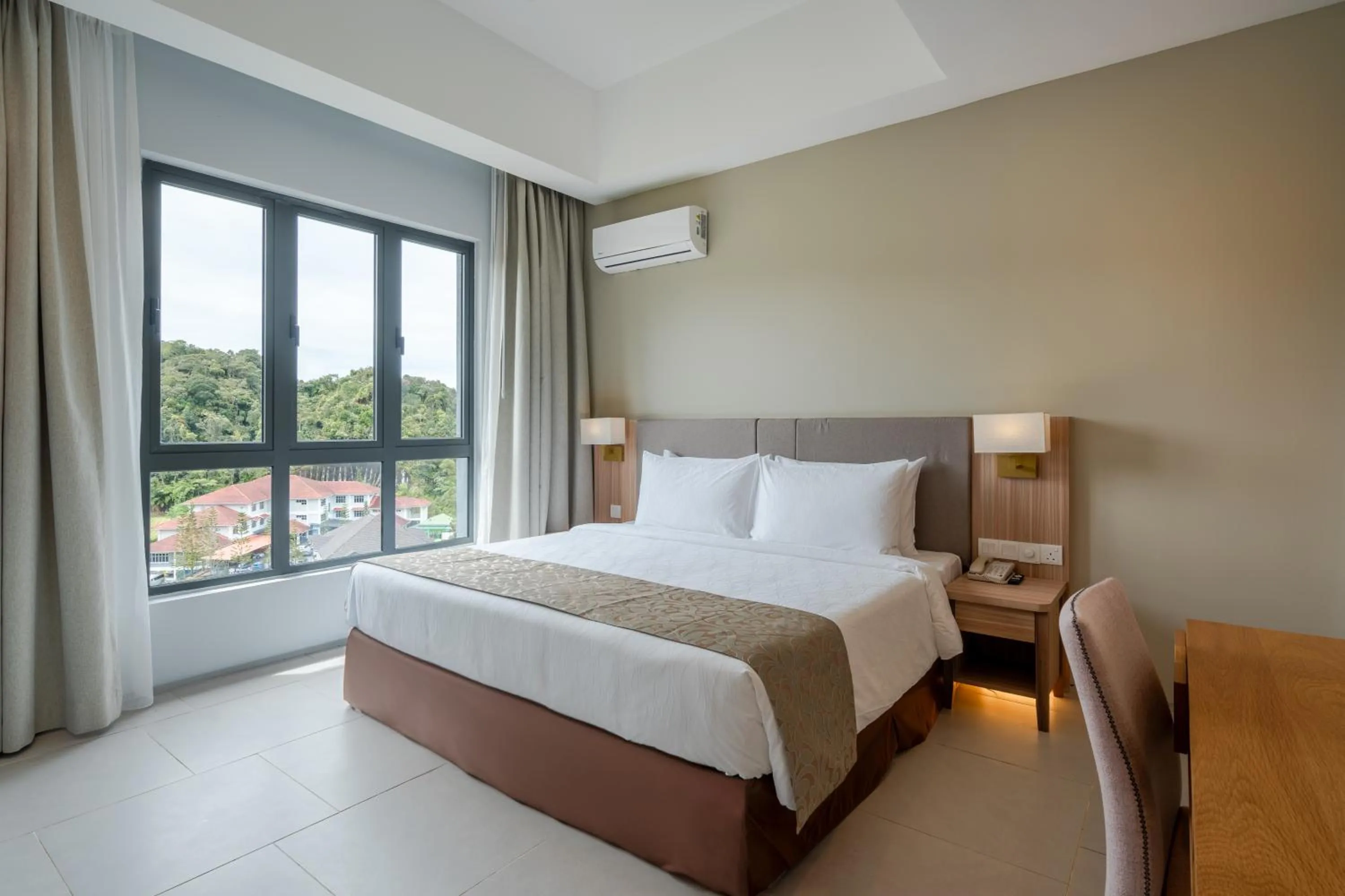 Bed in Zenith Suites Cameron