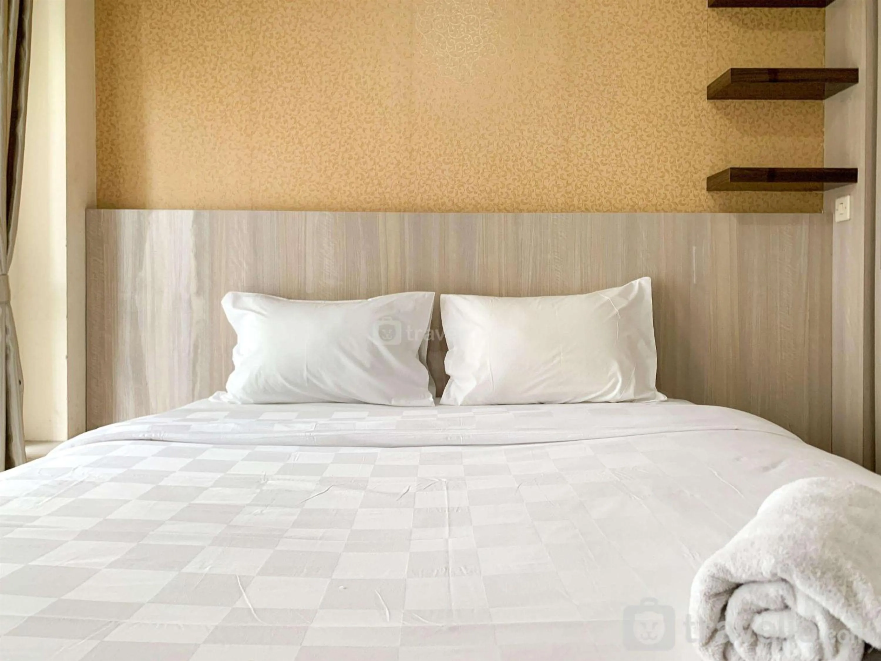 Bed in Modern Look and Comfy Studio Tifolia Apartment By Travelio