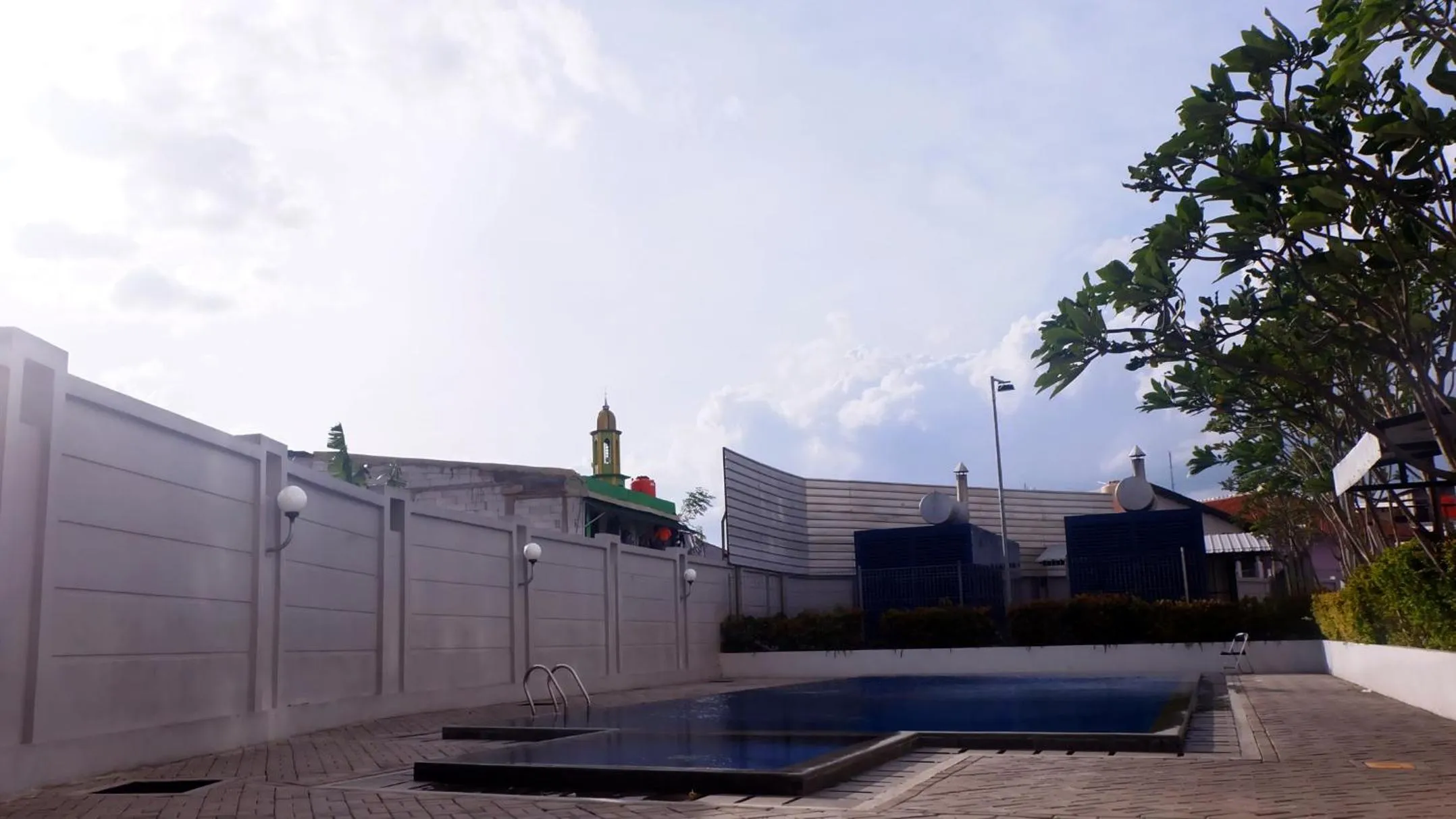 Swimming pool in Modern Look and Comfy Studio Tifolia Apartment By Travelio