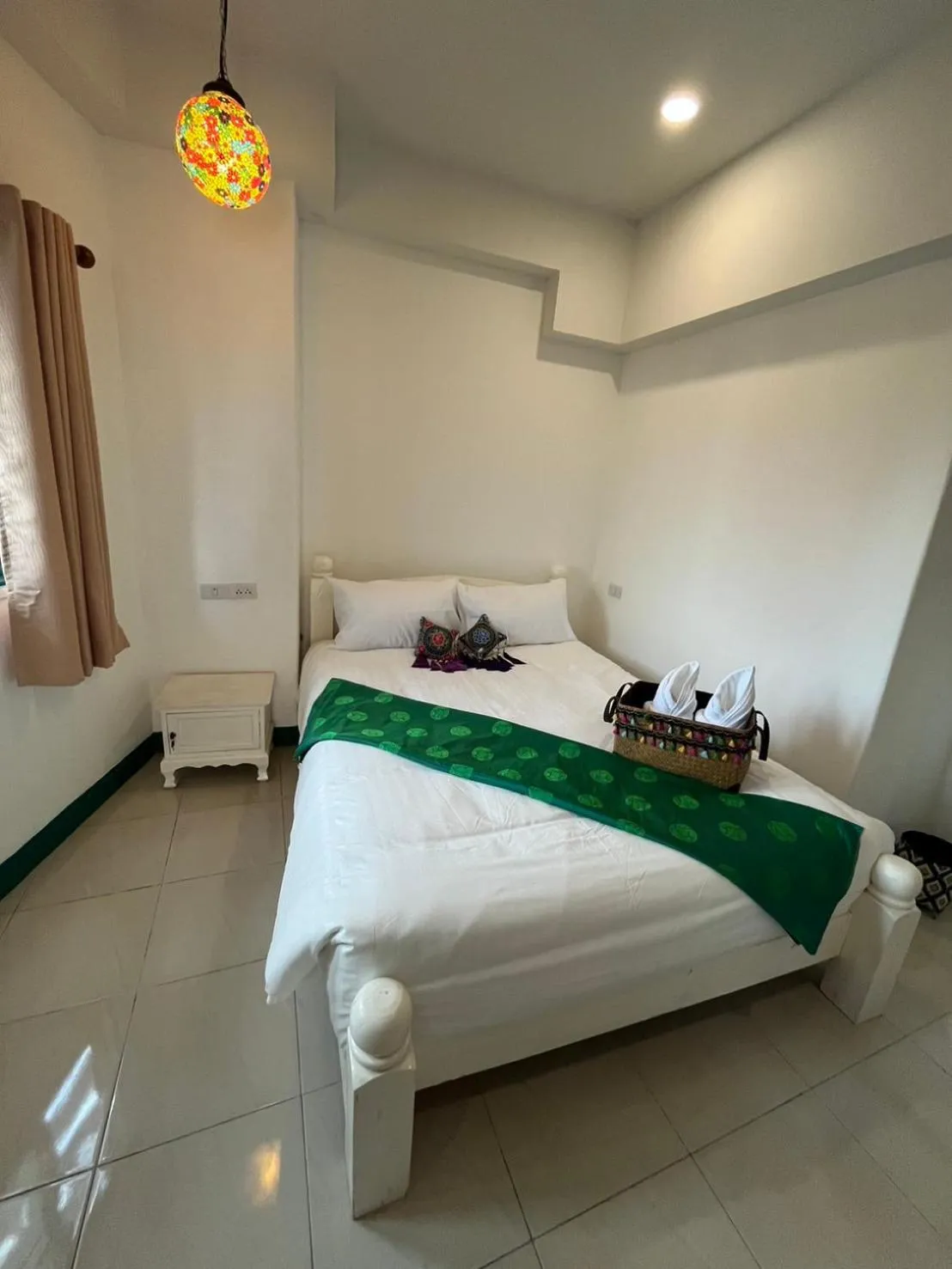 Bed in Yellow Lamoon Hotel