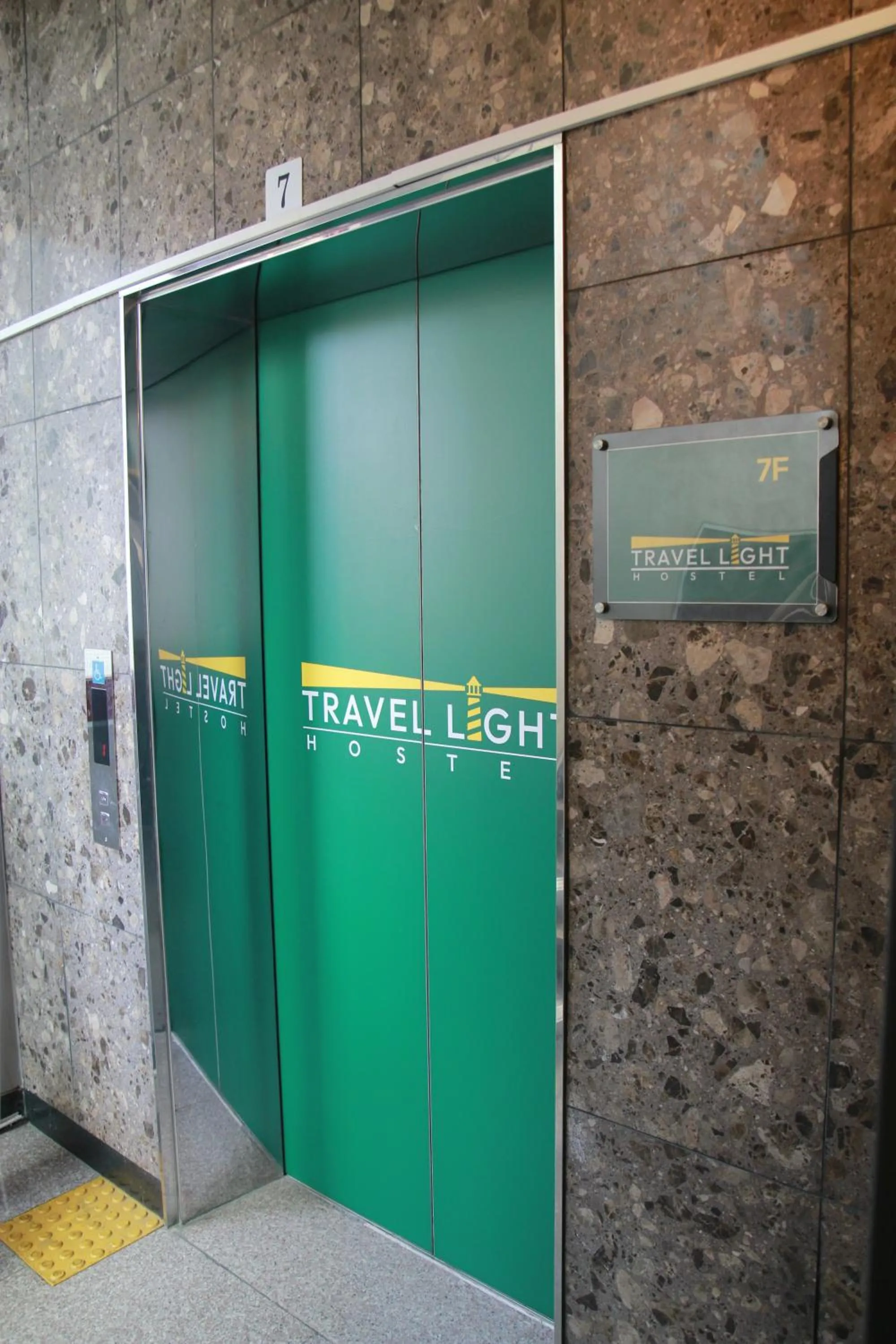 elevator in Travel Light Hostel