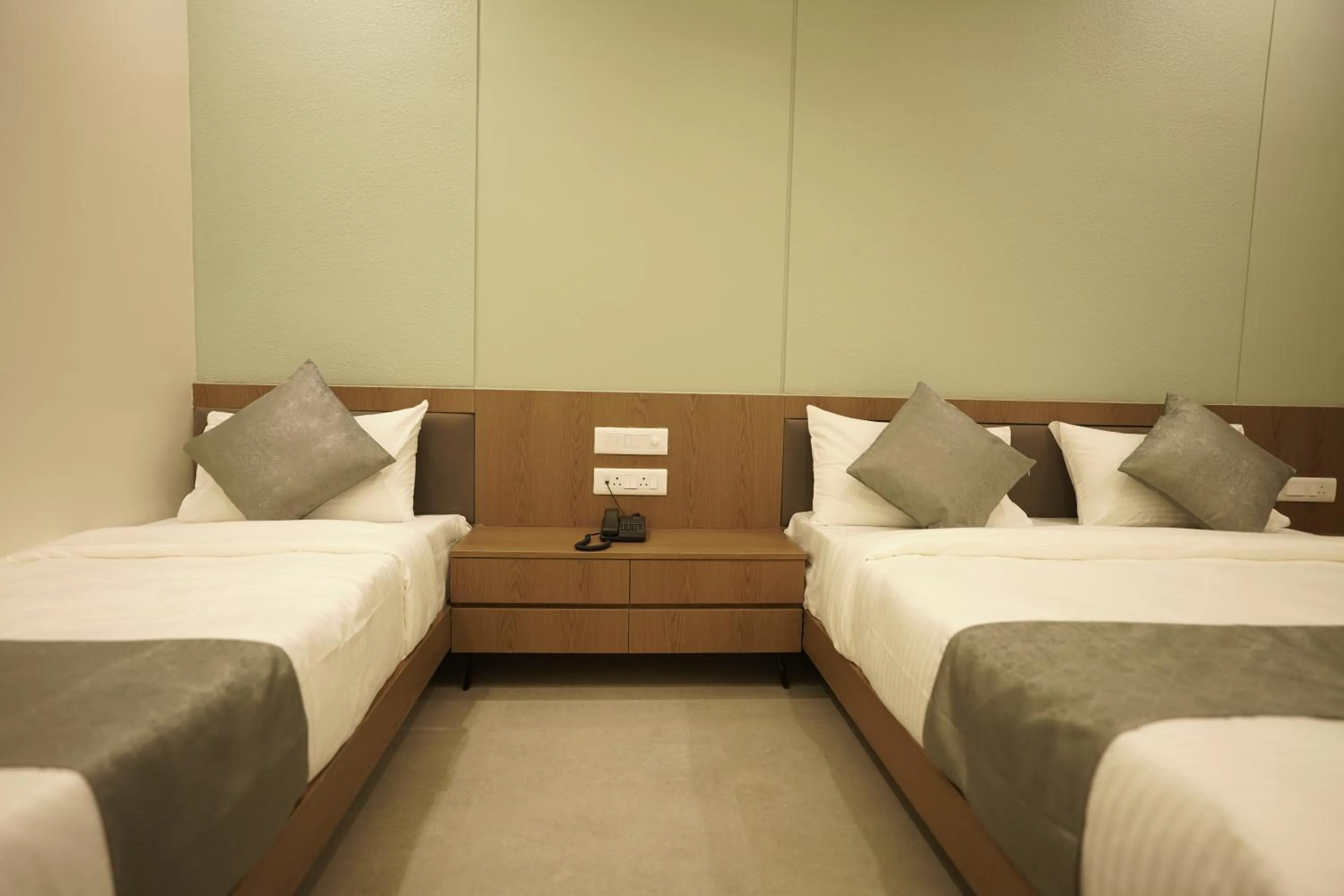 Bed in A Square Executive Hotel