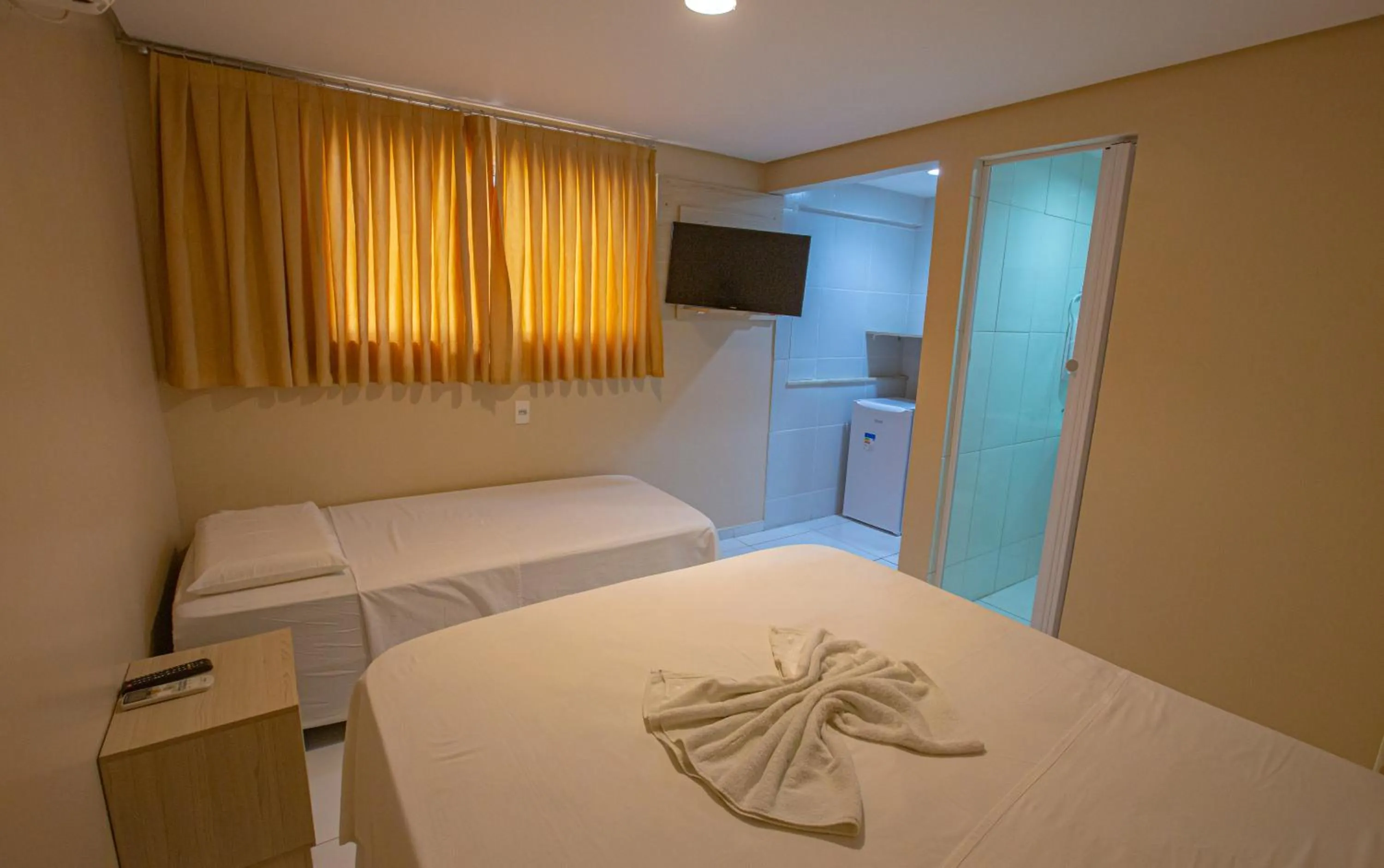 Bed in Pousada Estrela Dourada