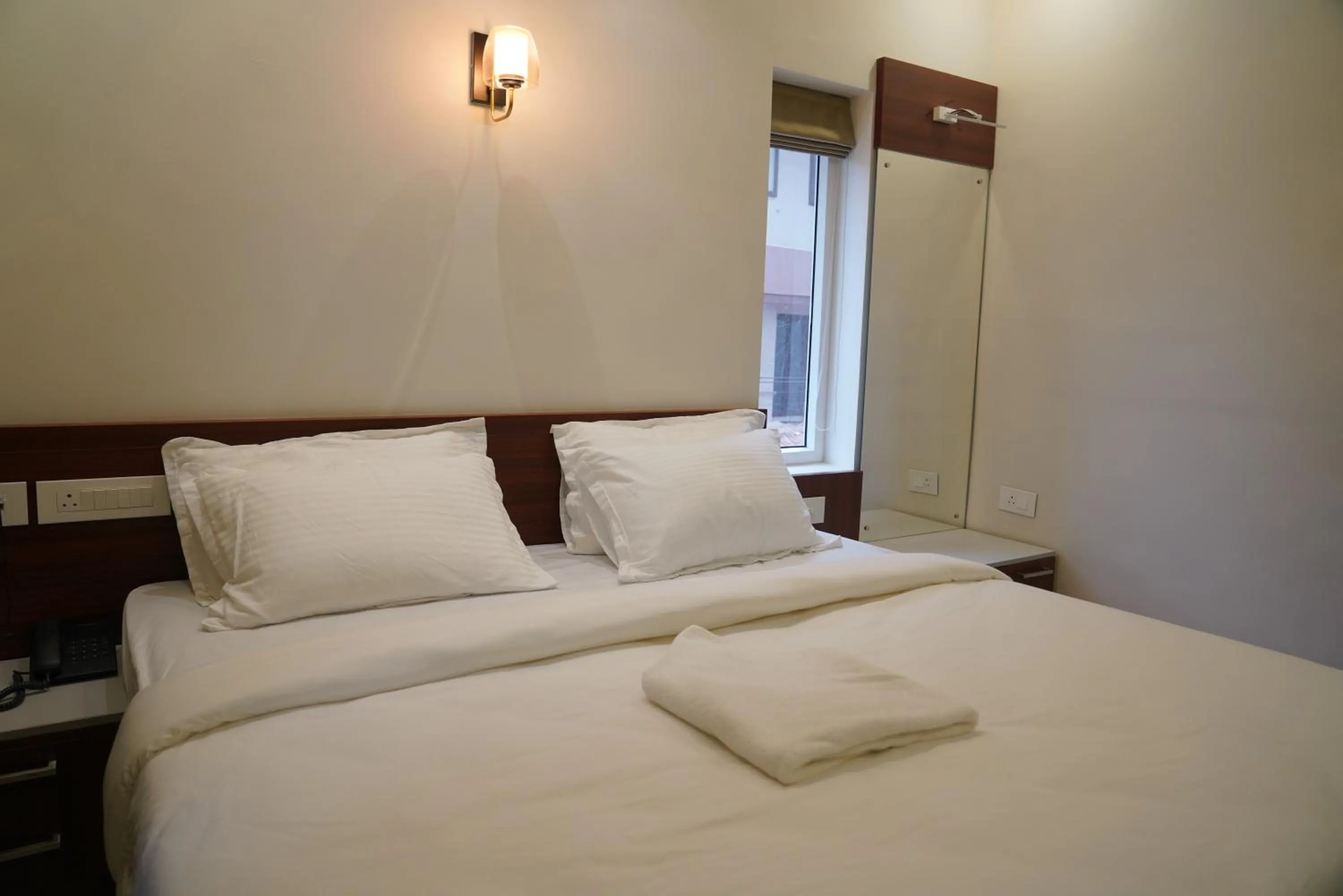 Bed in K Grandeur Hotels