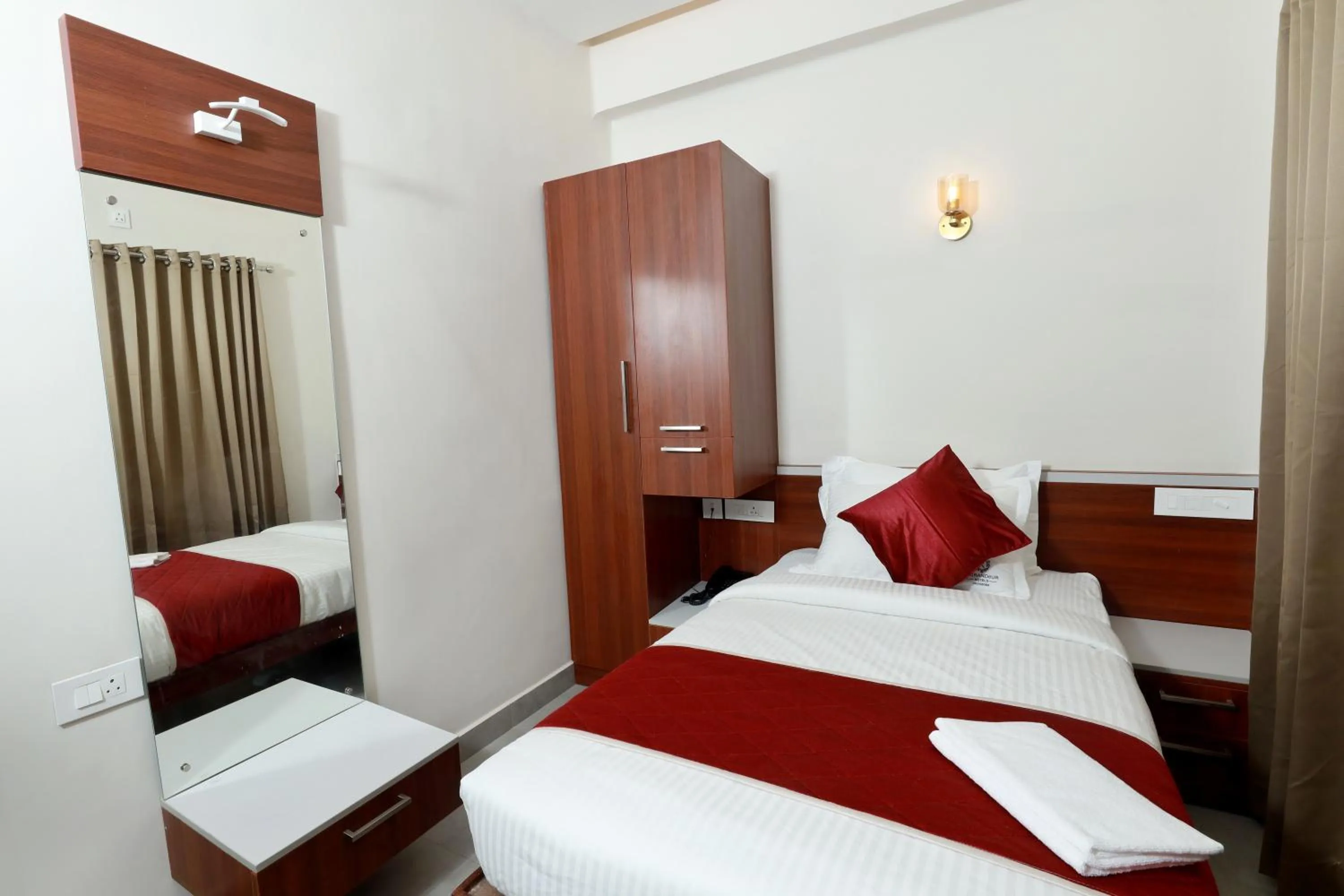 wardrobe, Bed in K Grandeur Hotels