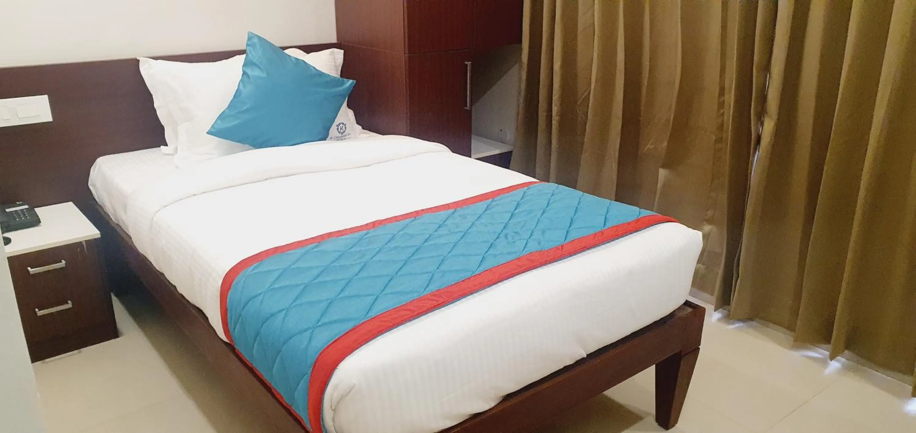 Bed in K Grandeur Hotels