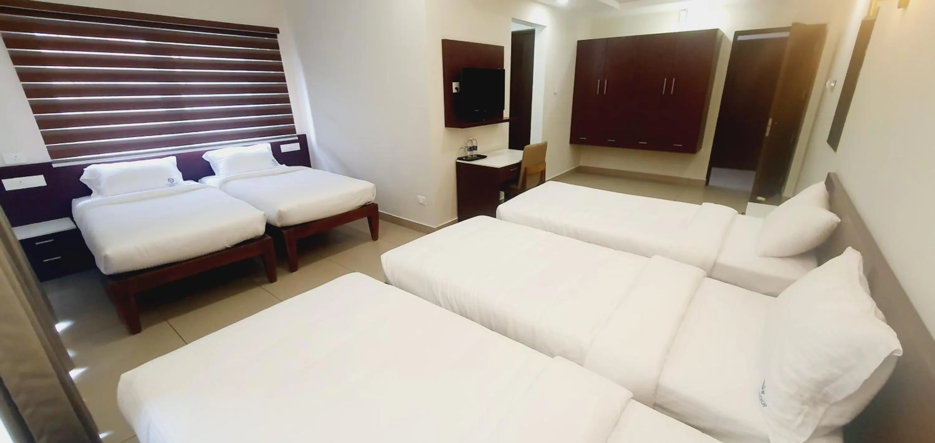 Bed in K Grandeur Hotels