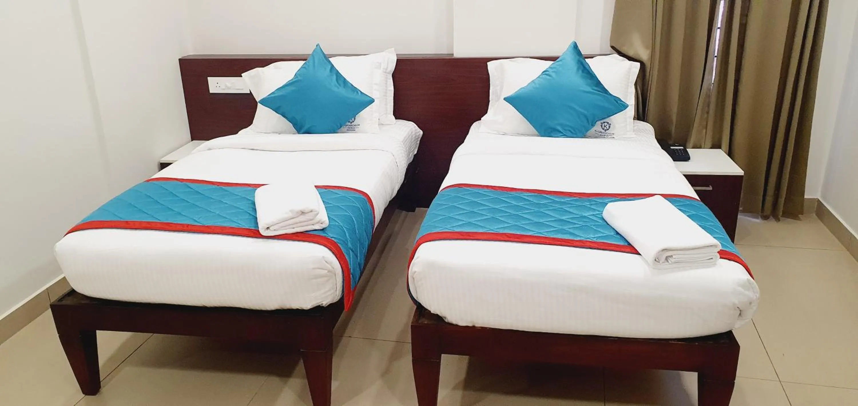 Bed in K Grandeur Hotels