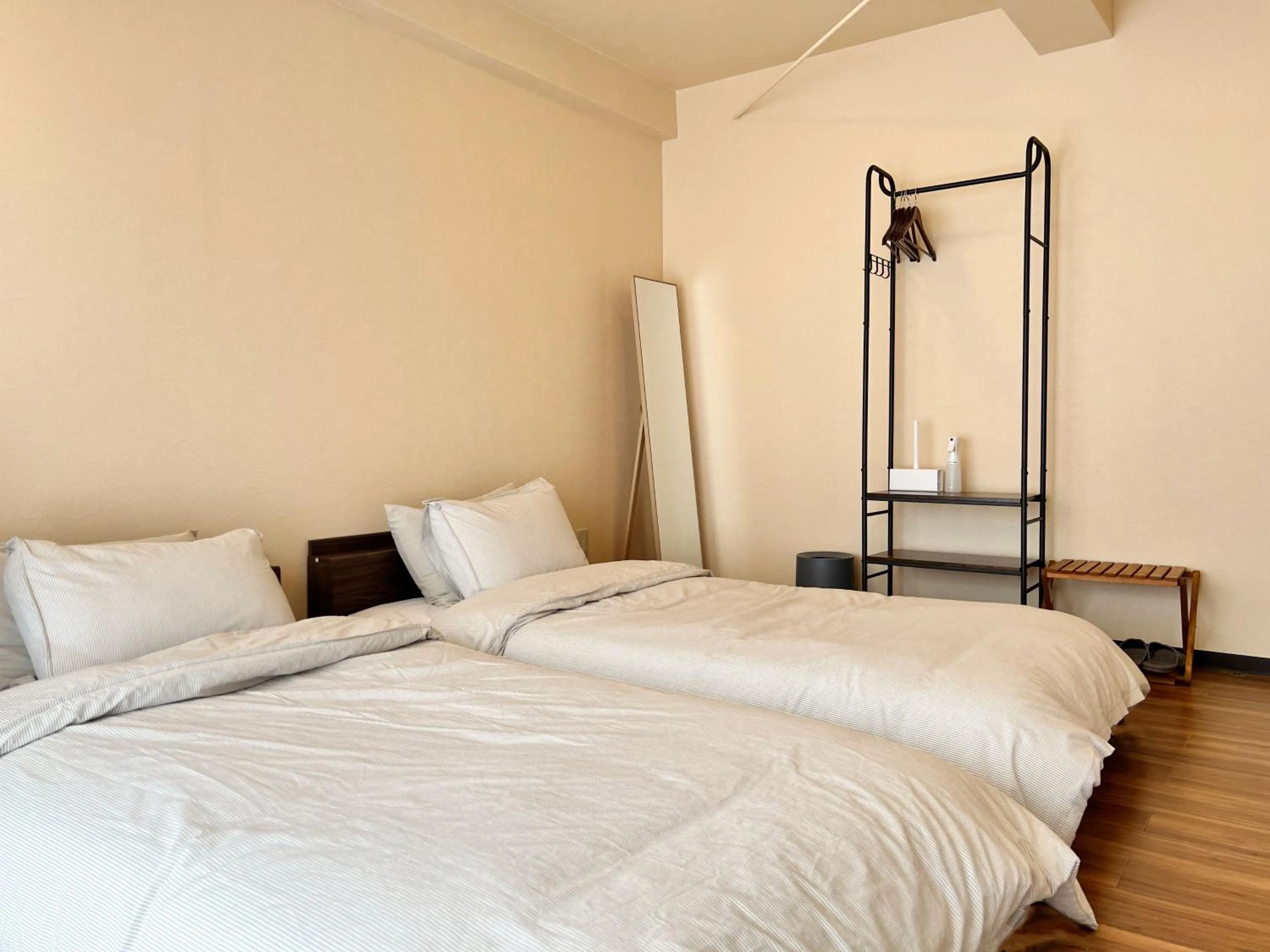 Bed in Jinya Sunset Inn by Murasaki