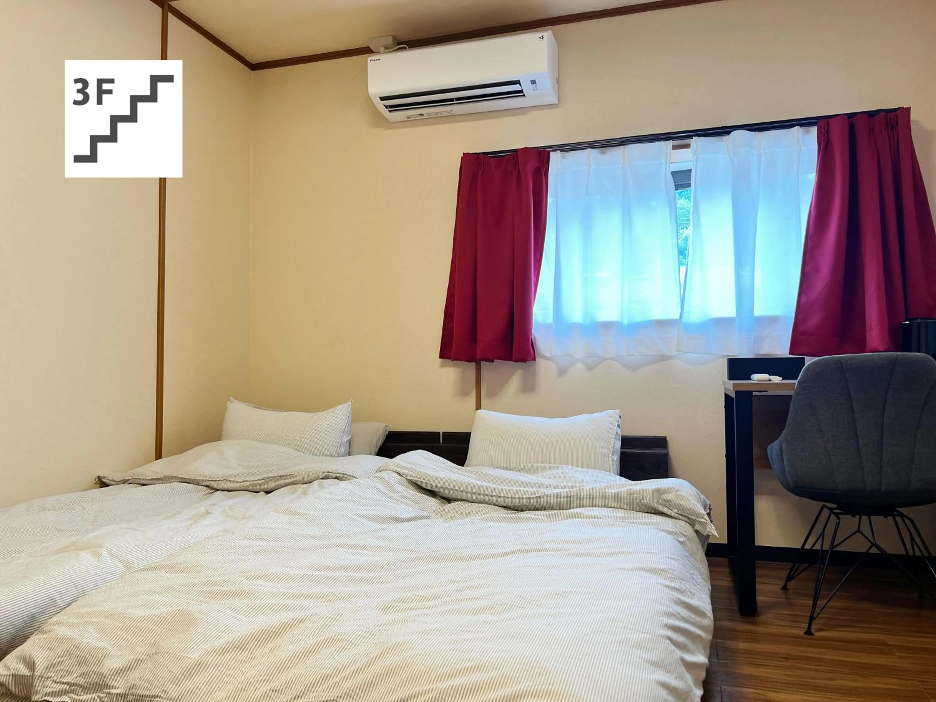 Bed in Jinya Sunset Inn by Murasaki