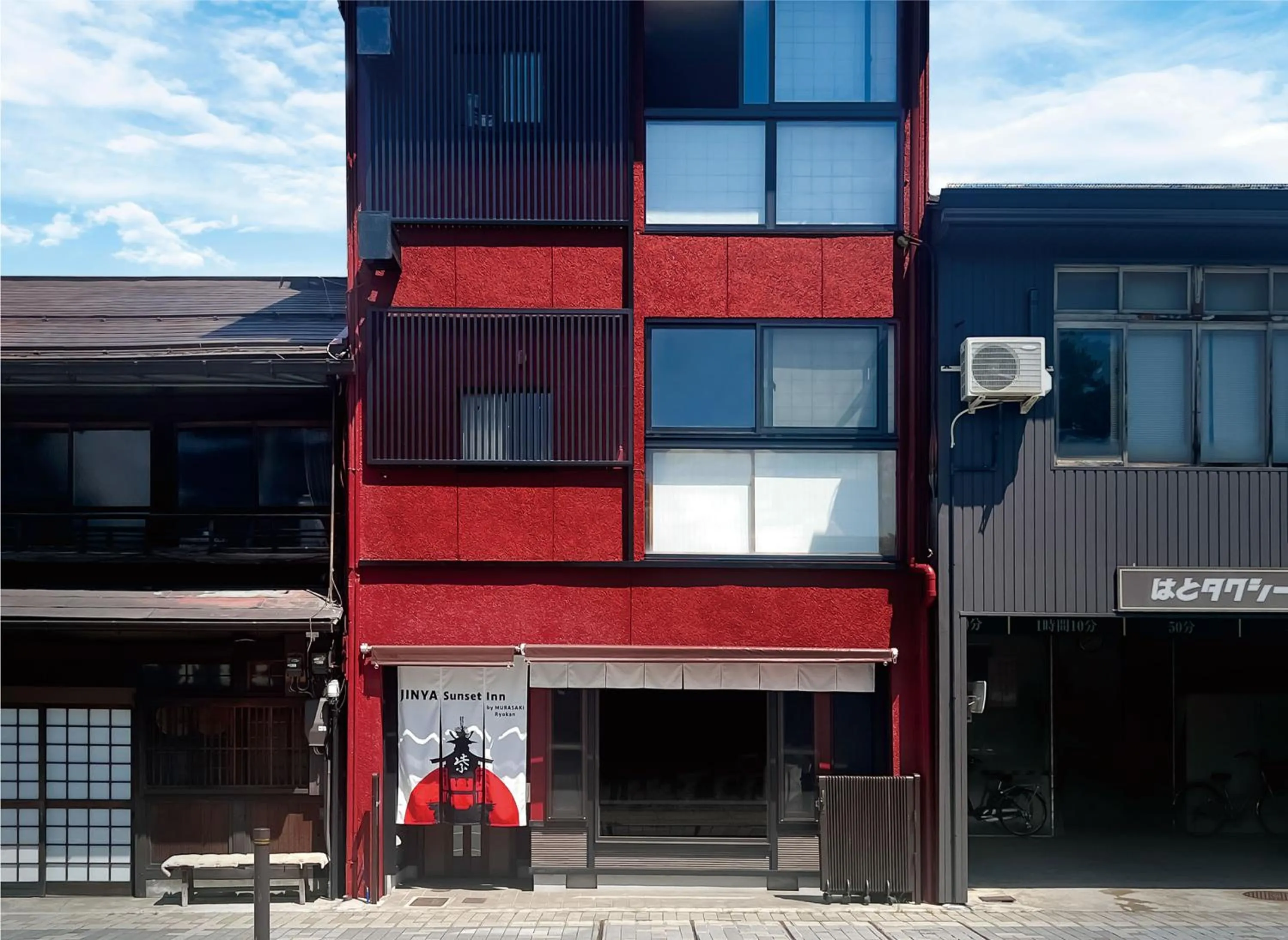 Property building in Jinya Sunset Inn by Murasaki