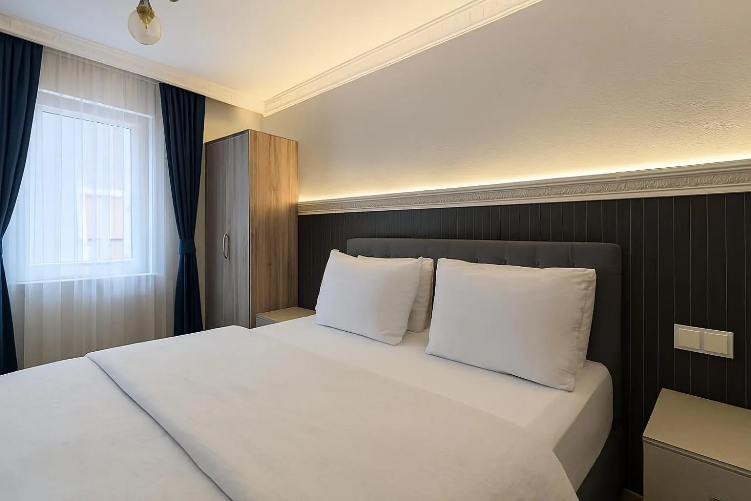Bed in Ozer Hotel & Apartments