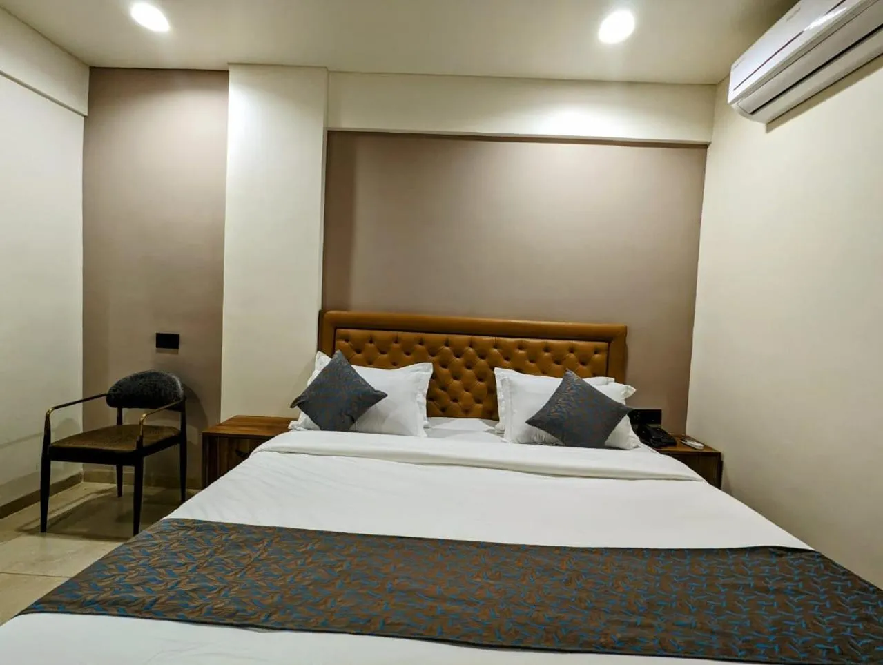 Bed in Hotel Majestic By NxtJen Hospitality