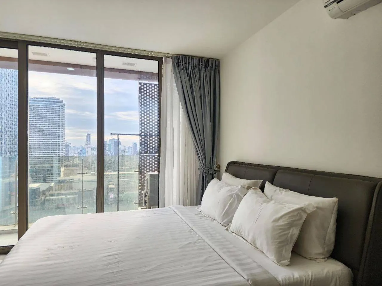 Bed in The PeAk Residence, Multi-Apartment by Emma