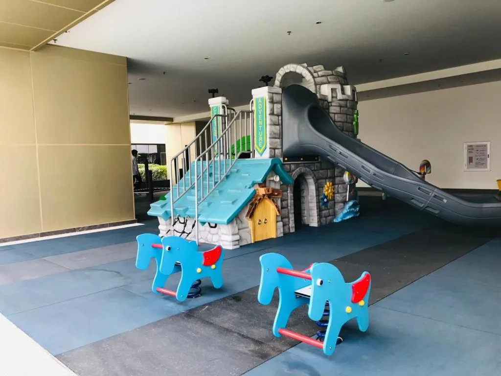 Children play ground in The PeAk Residence, Multi-Apartment by Emma