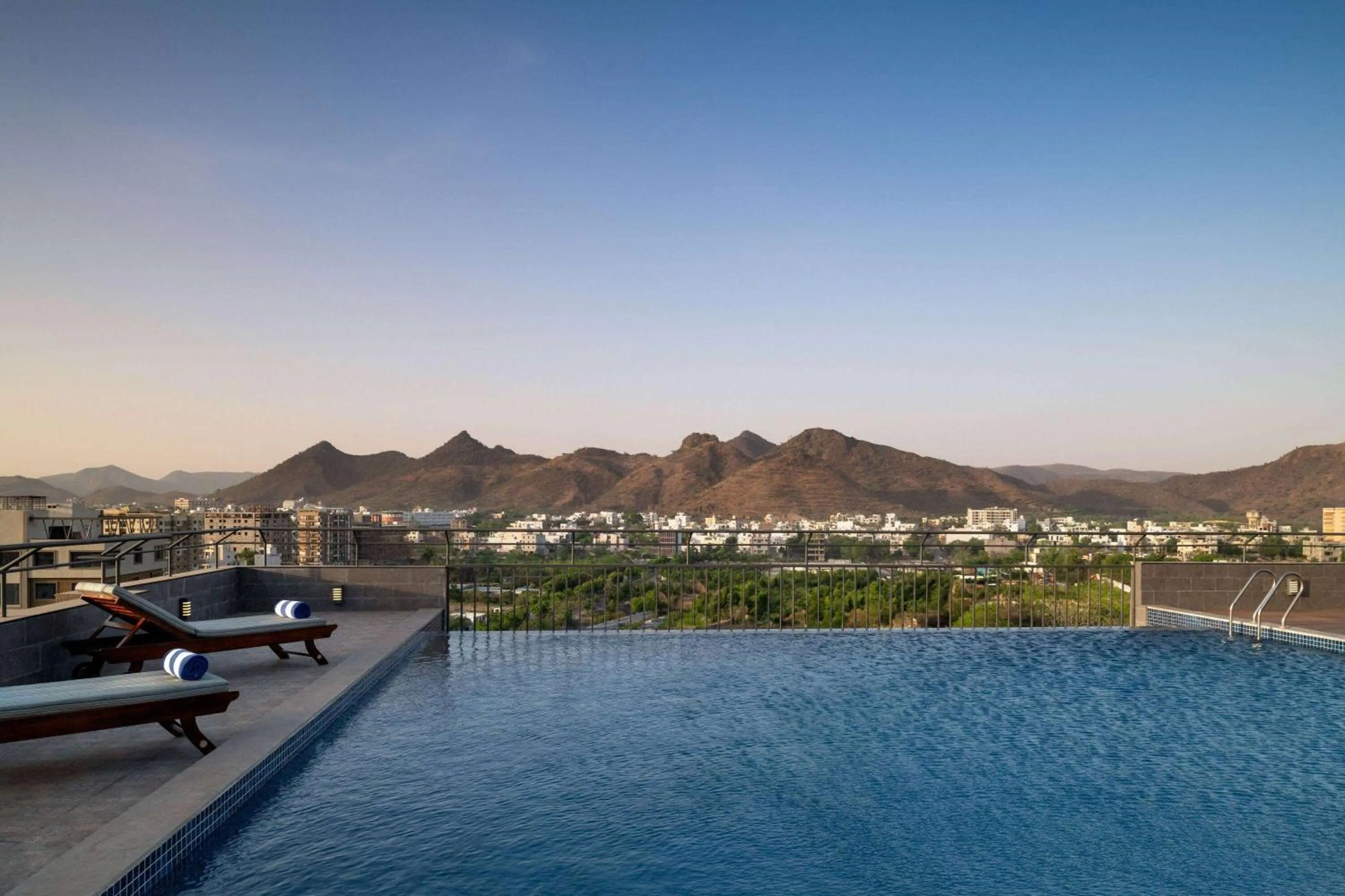 Swimming pool in Ramada Encore by Wyndham Udaipur Roopnagar