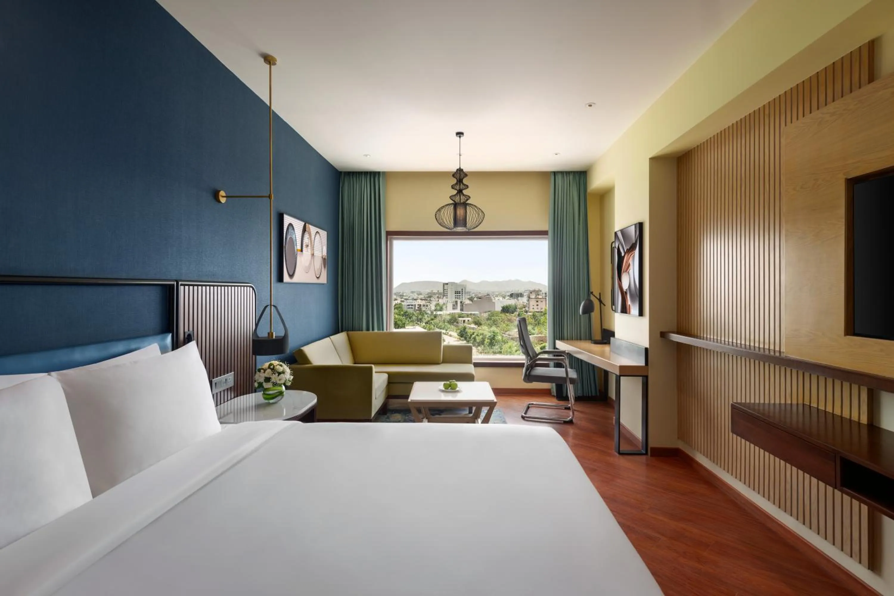 Bed in Ramada Encore by Wyndham Udaipur Roopnagar